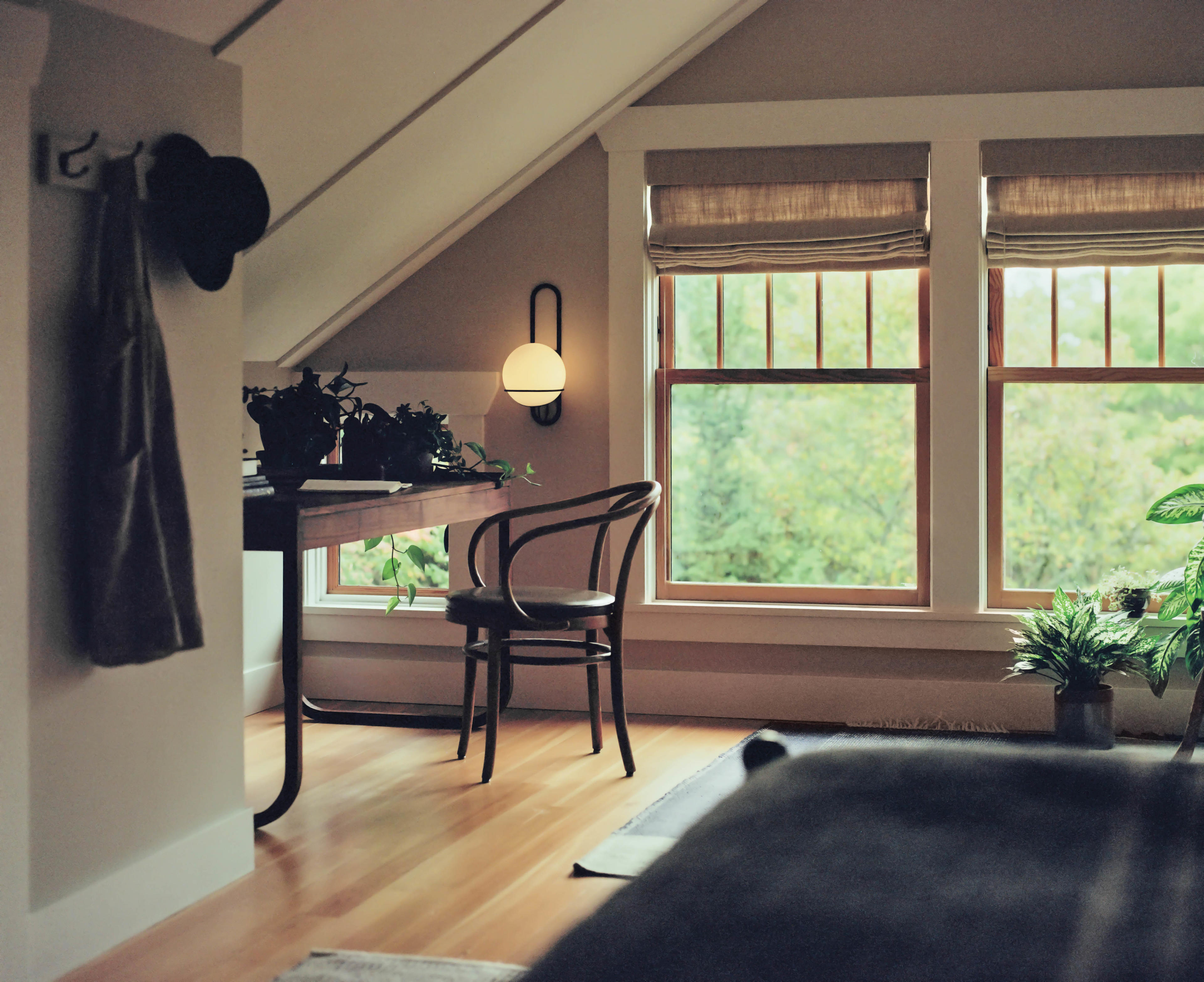 globular sconce in a moody attic office