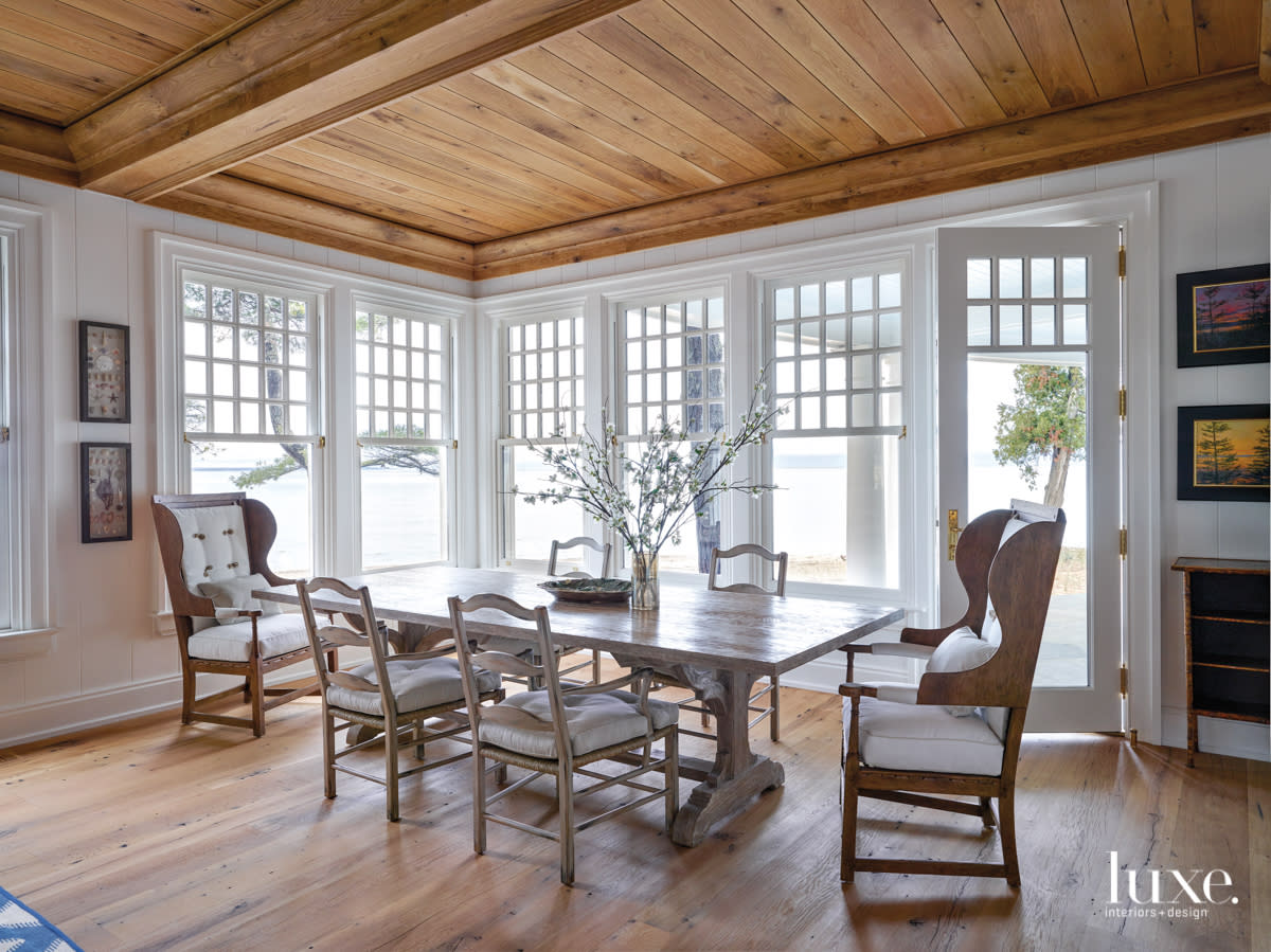 The screened-in porch overlooks the lake.