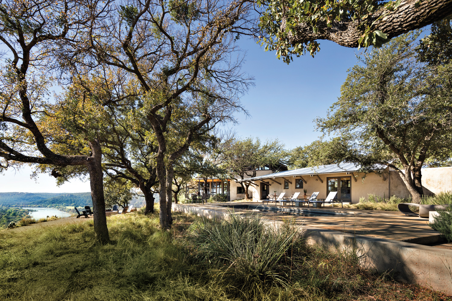 exterior landscaping and pool of a home with panoramic river views