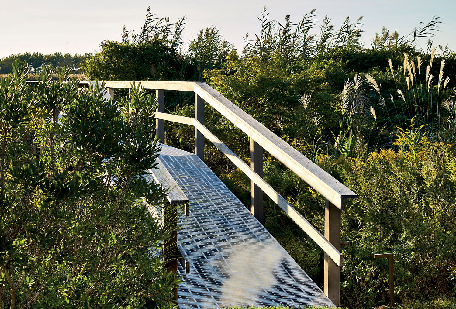 small bridge among the natural landscape at a Hamptons home