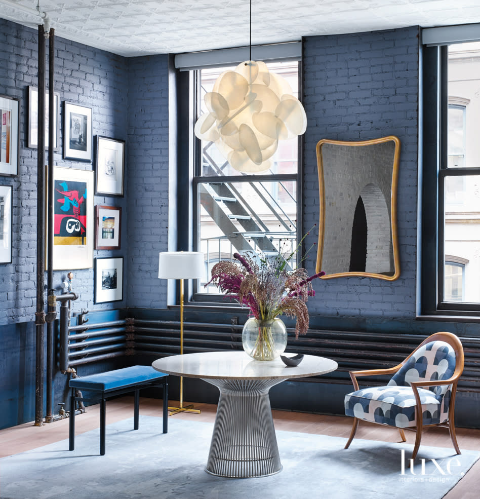 blue brick walls, bench, chair and table