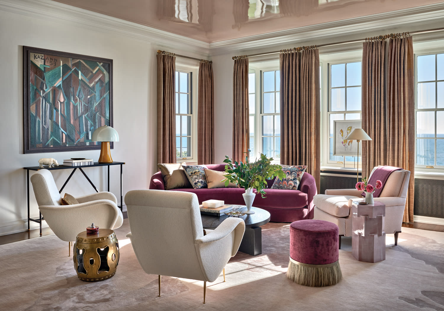classic living room with pink and white furnishings and a pale pink-lacquered ceiling