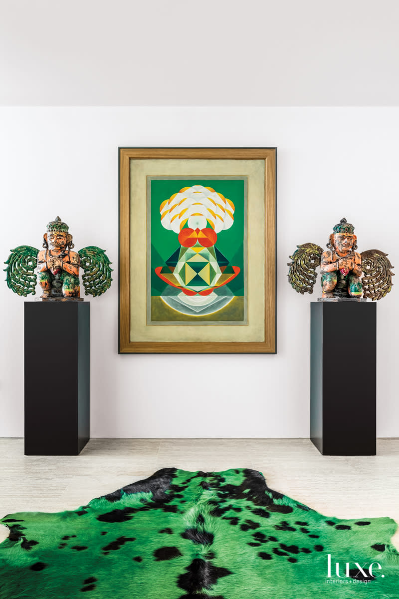 antique garuda sculptures on pedestals