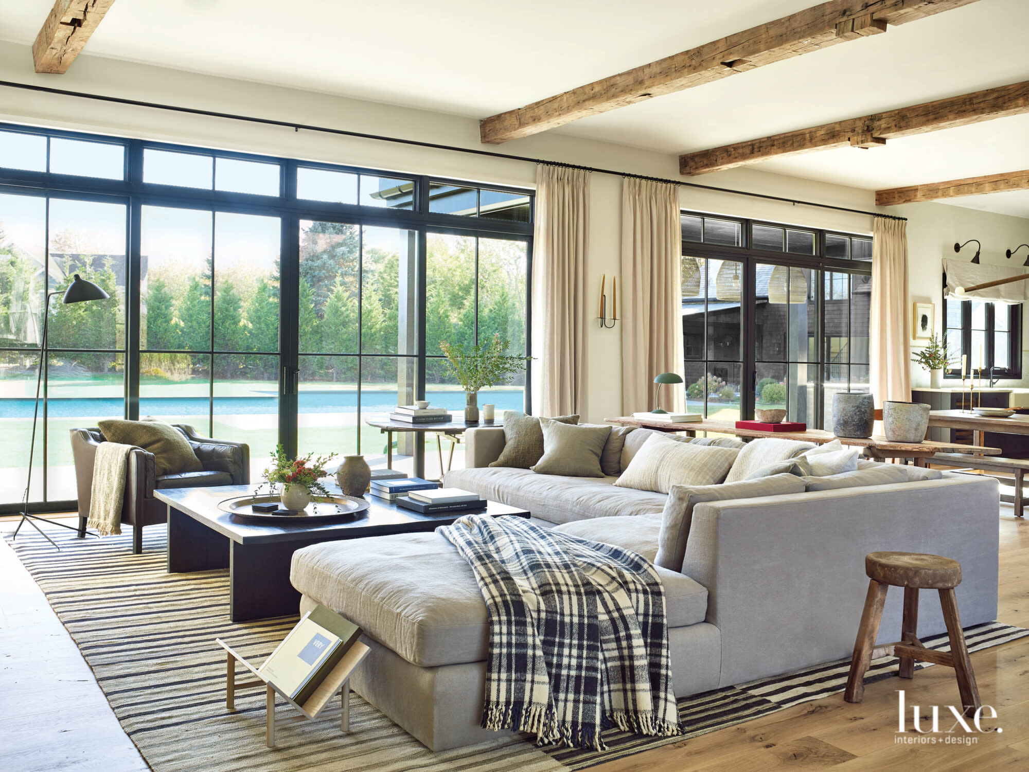 An all-white sectional sofa sits in the bright living room