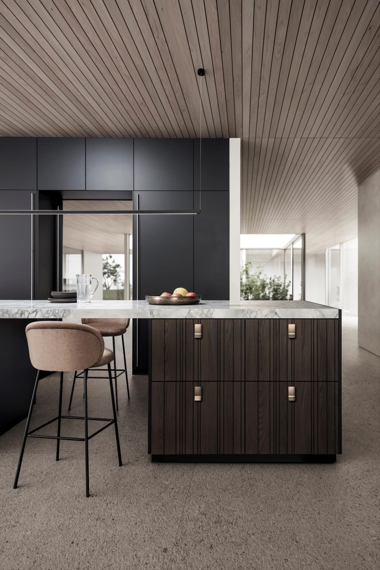 a kitchen with a counter and stools