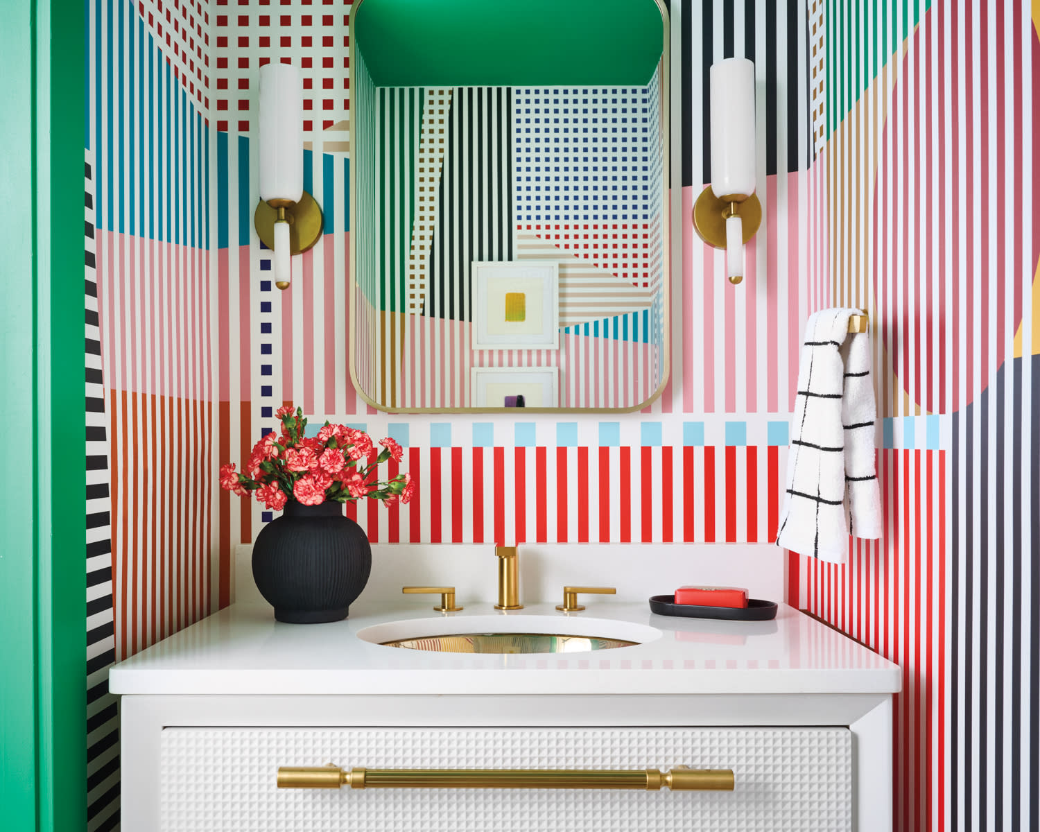 colorful, graphic wallcovering lines a modern powder room