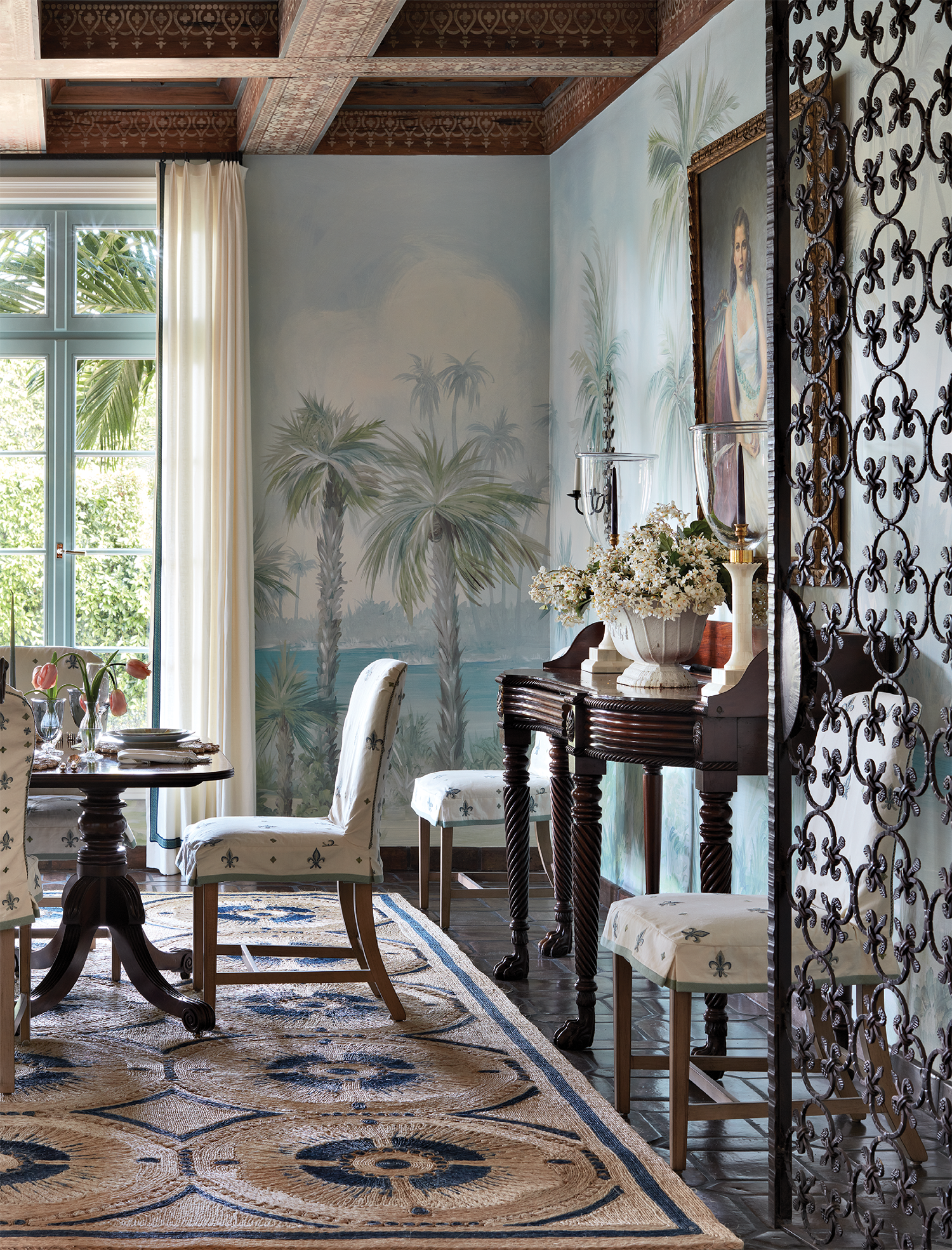 scenic wallpaper wraps a classic dining room
