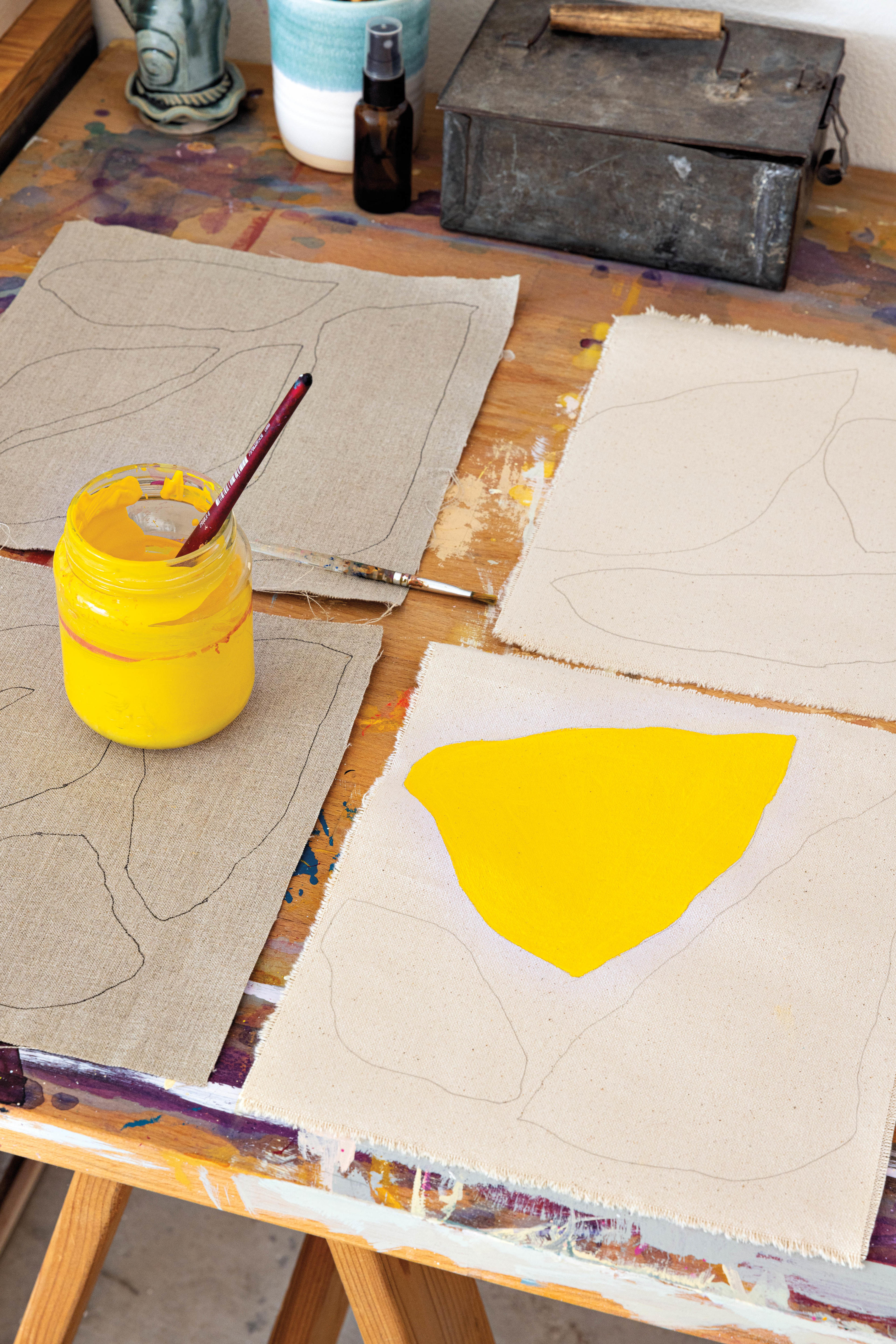 yellow paint on a canvas