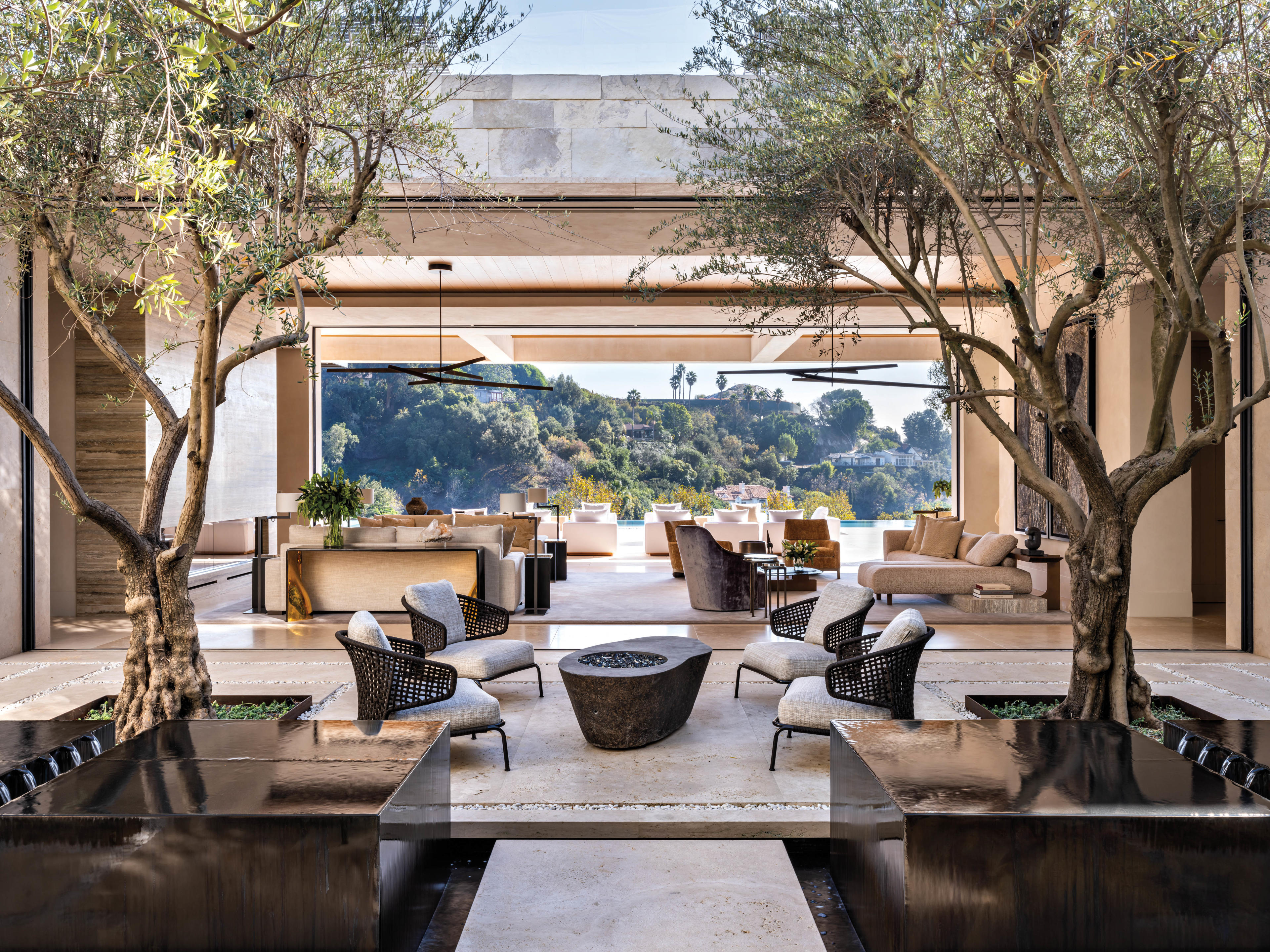 shaded outdoor courtyard with fire pit overlooking california views