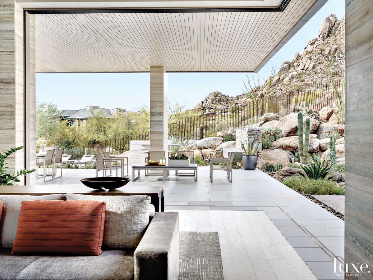 Contemporary Neutral Indoor-Outdoor Space with Motorized Door Panels ...