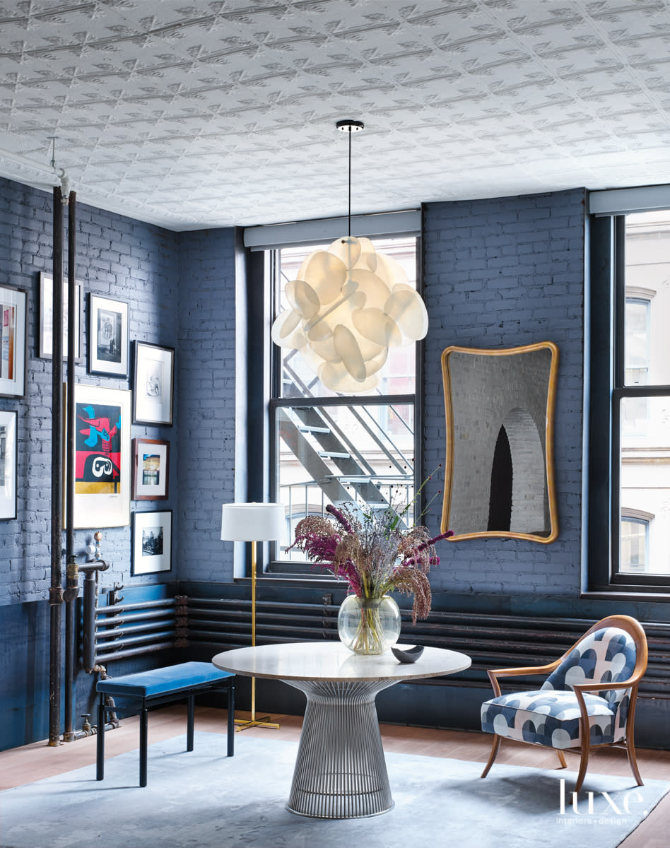 blue brick walls, bench, chair and table