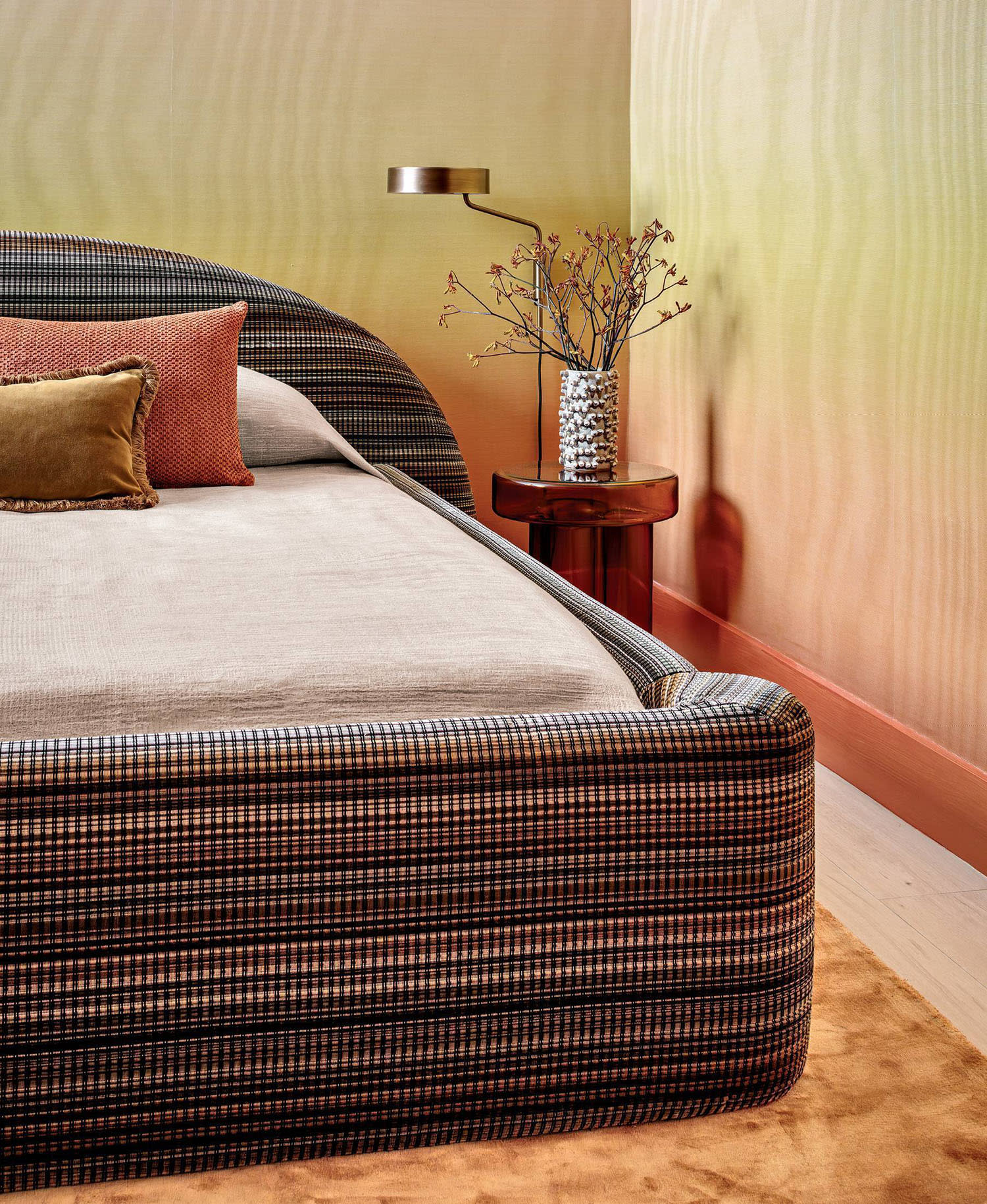 guest bedroom wrapped with an orange and yellow ombre wallcovering