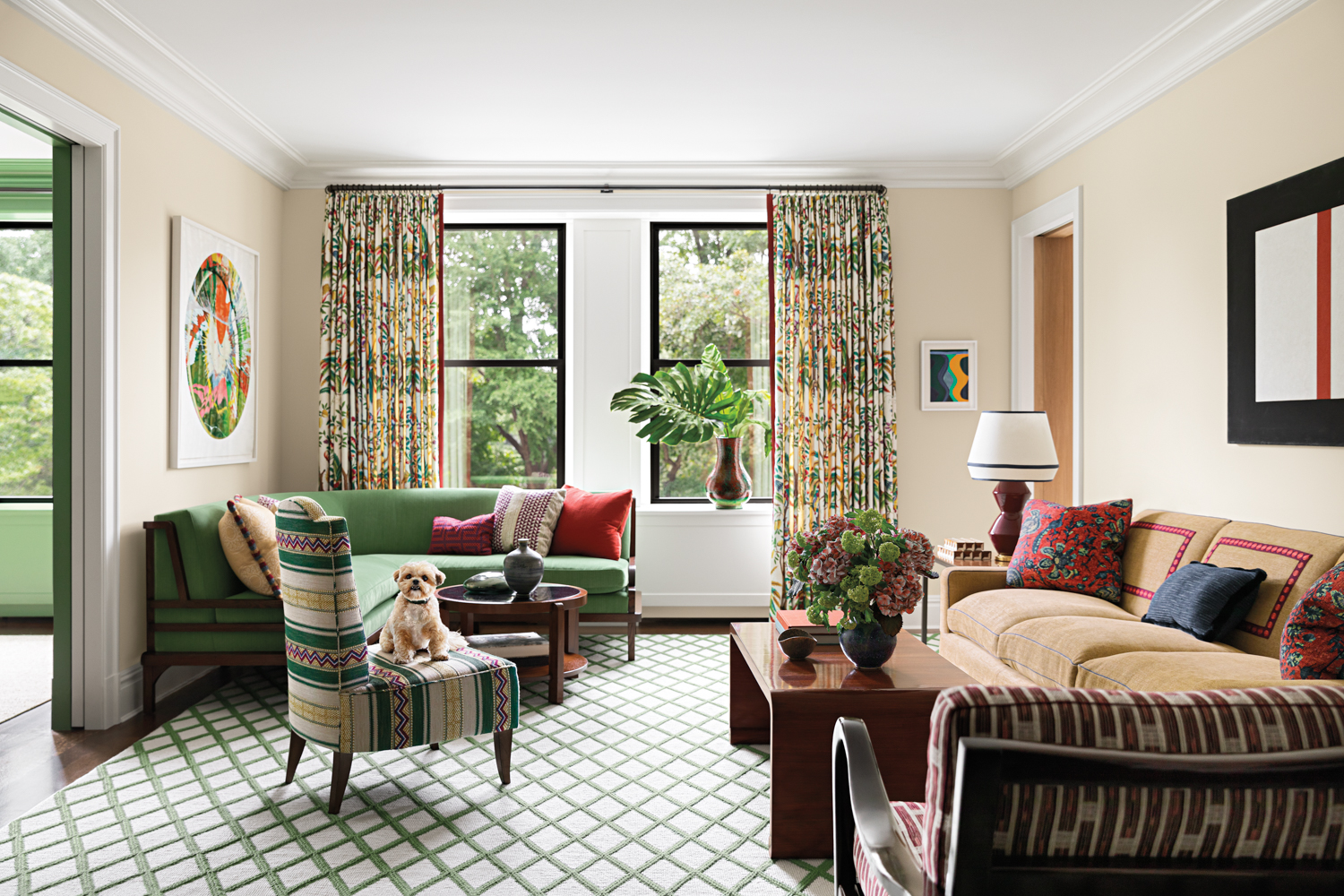 neutral living room with lattice rug and green banquette