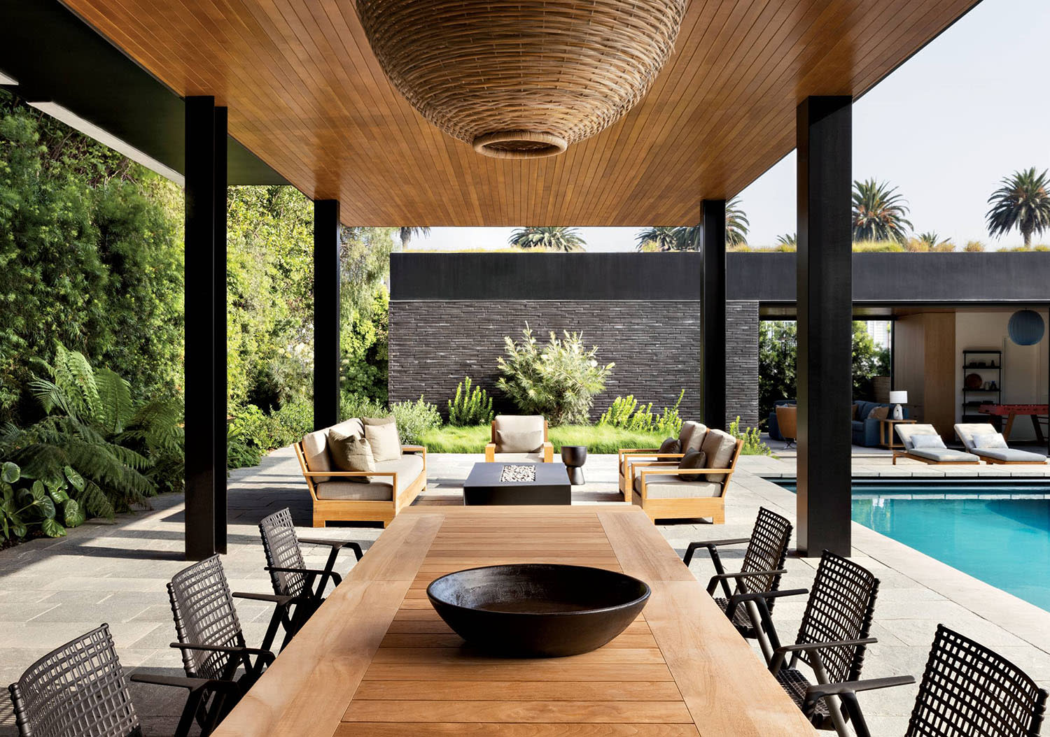 poolside dining area of a modernist Santa Monica home