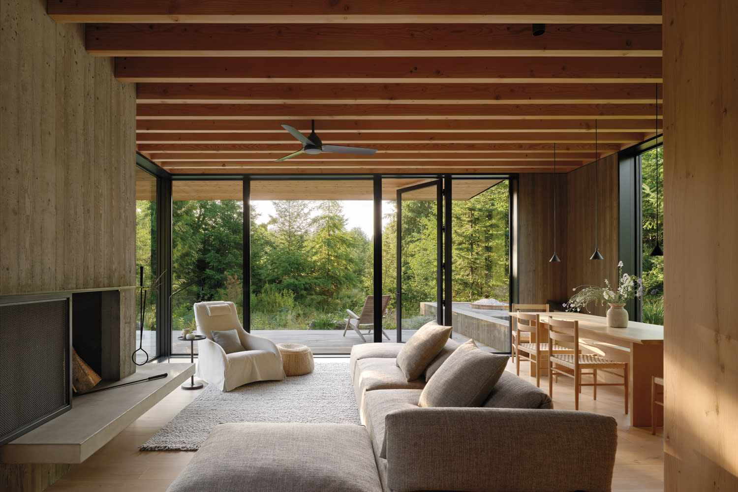 A living room with a charming fireplace and a rustic wooden ceiling, enhancing the room's warmth and comfort.