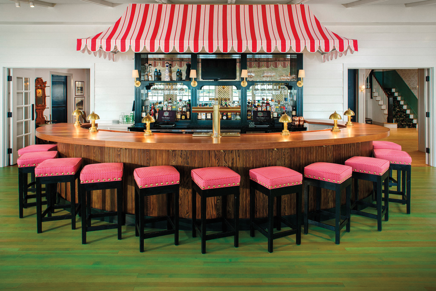 red and white awning covering a bar in a classic Americana hotel