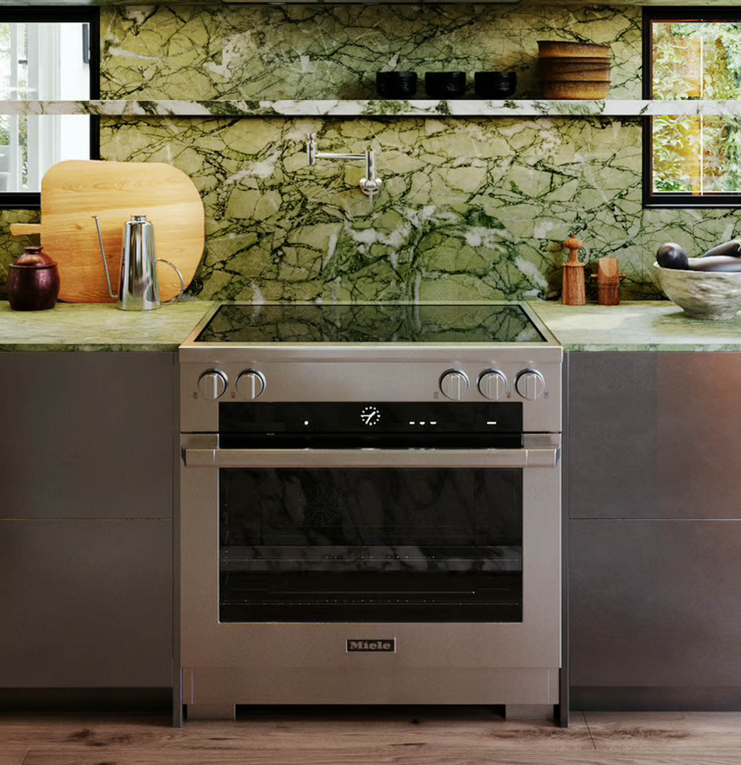 A stylish kitchen with green marble walls and a sleek stove, showcasing a contemporary design aesthetic.