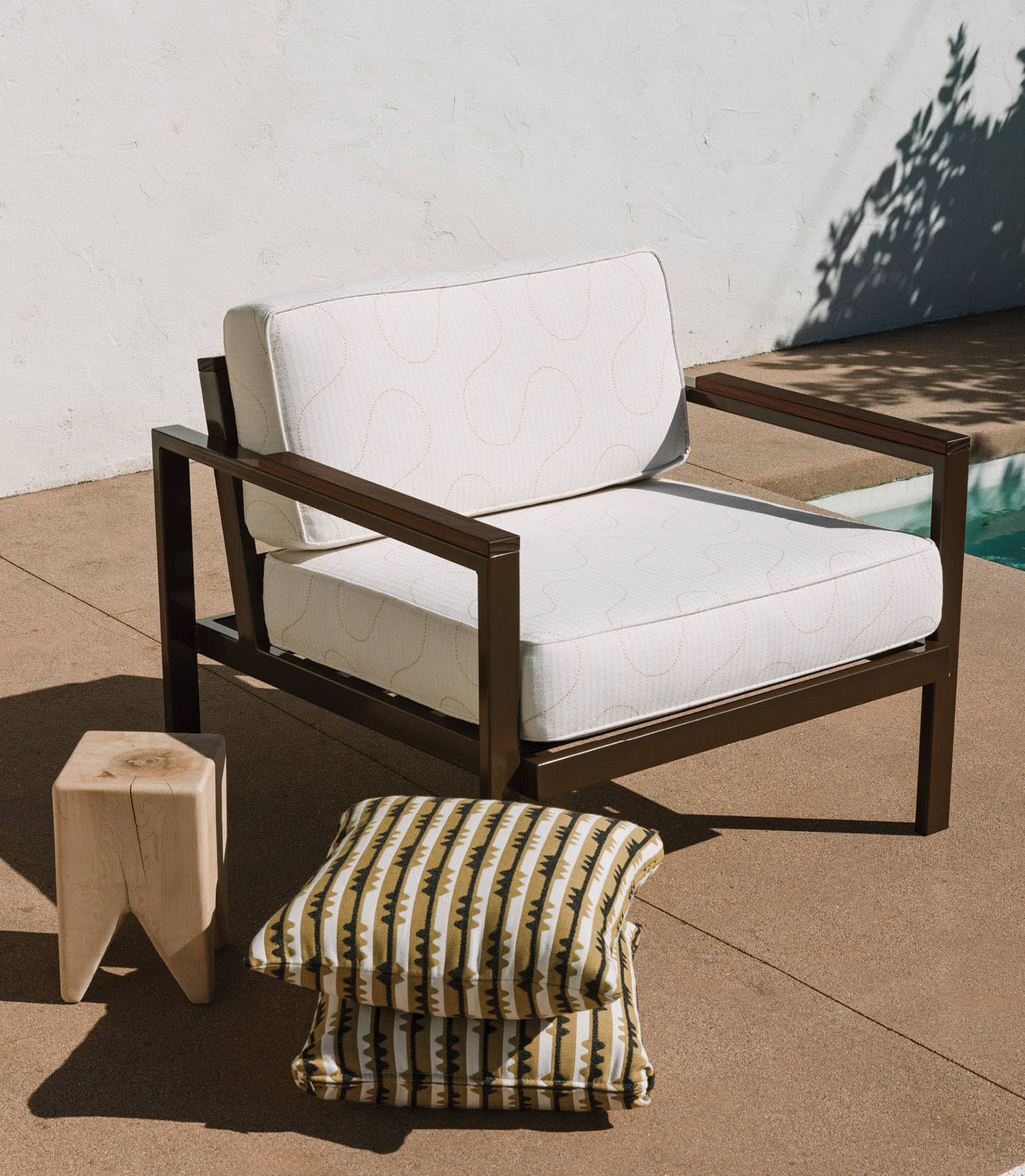 patio vignette featuring a throw pillow from the Sunbrella x Block Shop collaboration