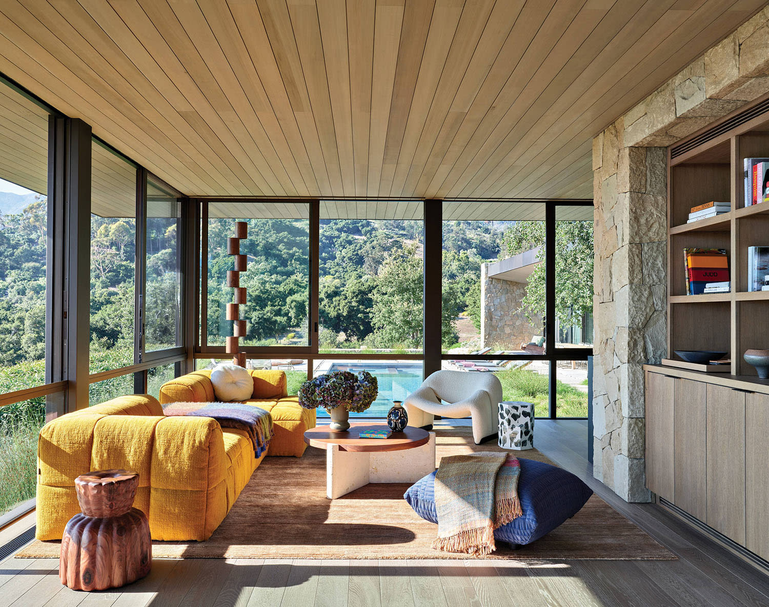 modern pool lounge room with a yellow sofa