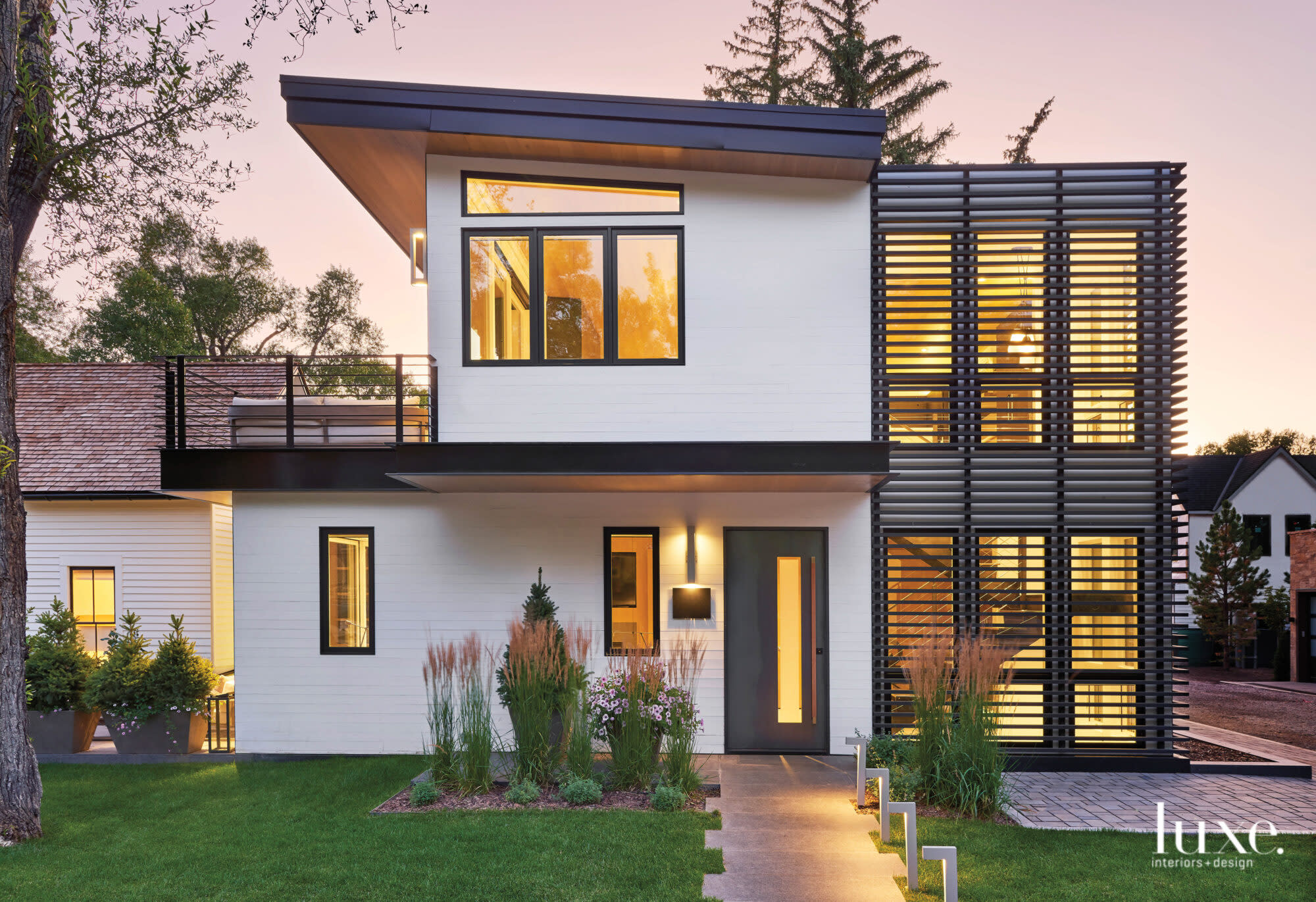 The back of the lot holds a very modern home.