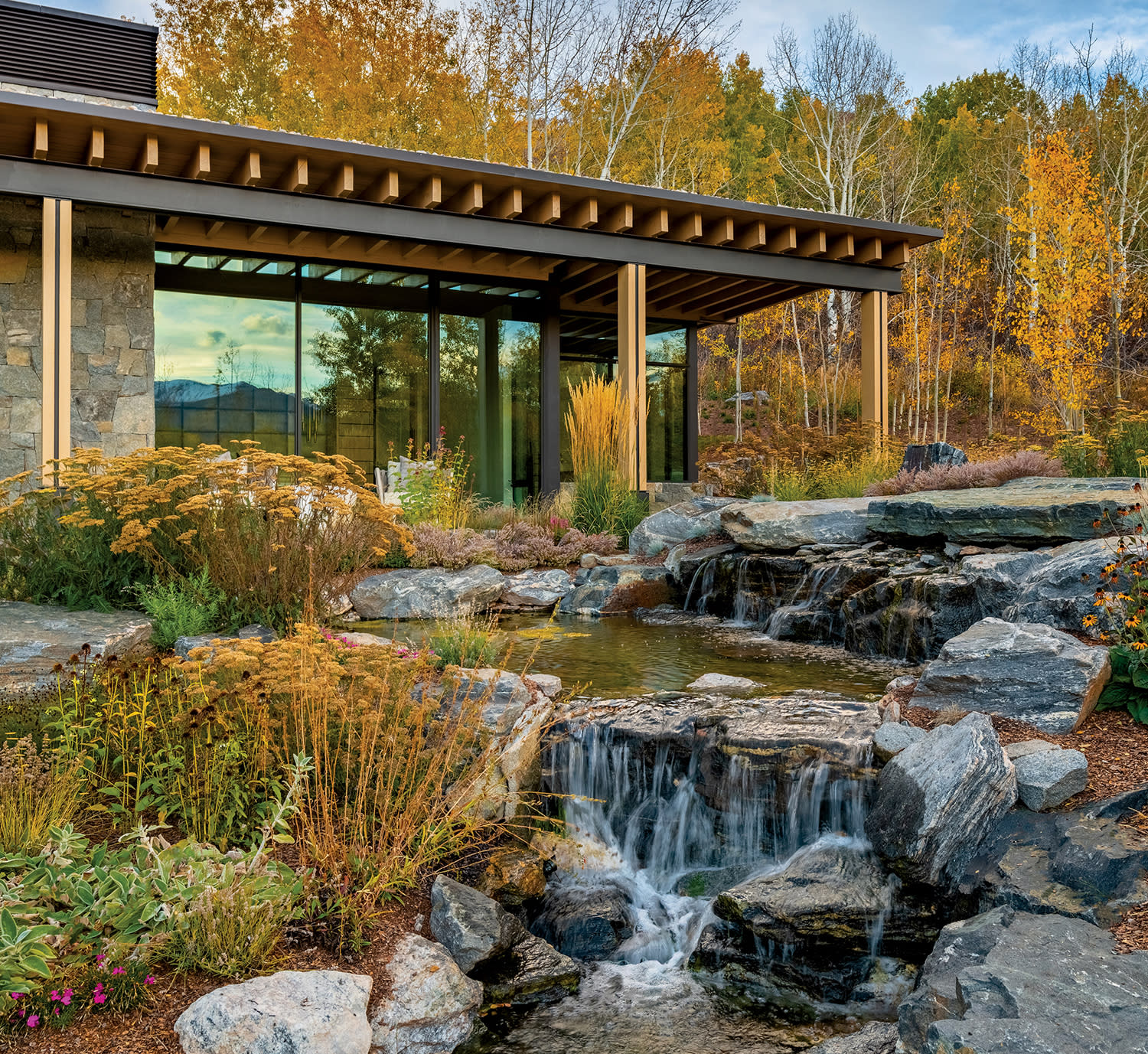 exterior of a Colorado mountain home surrounded by fall foliage