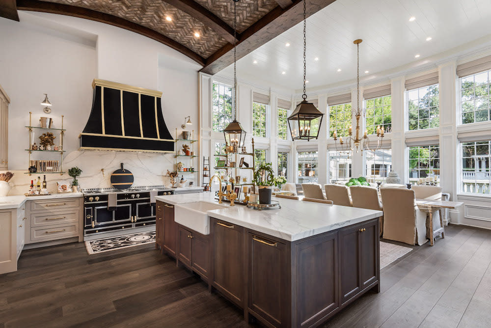 traditional kitchen and dining room with wood beams on ceiling and hard wood floors in Northern California home by De Mattei Construction