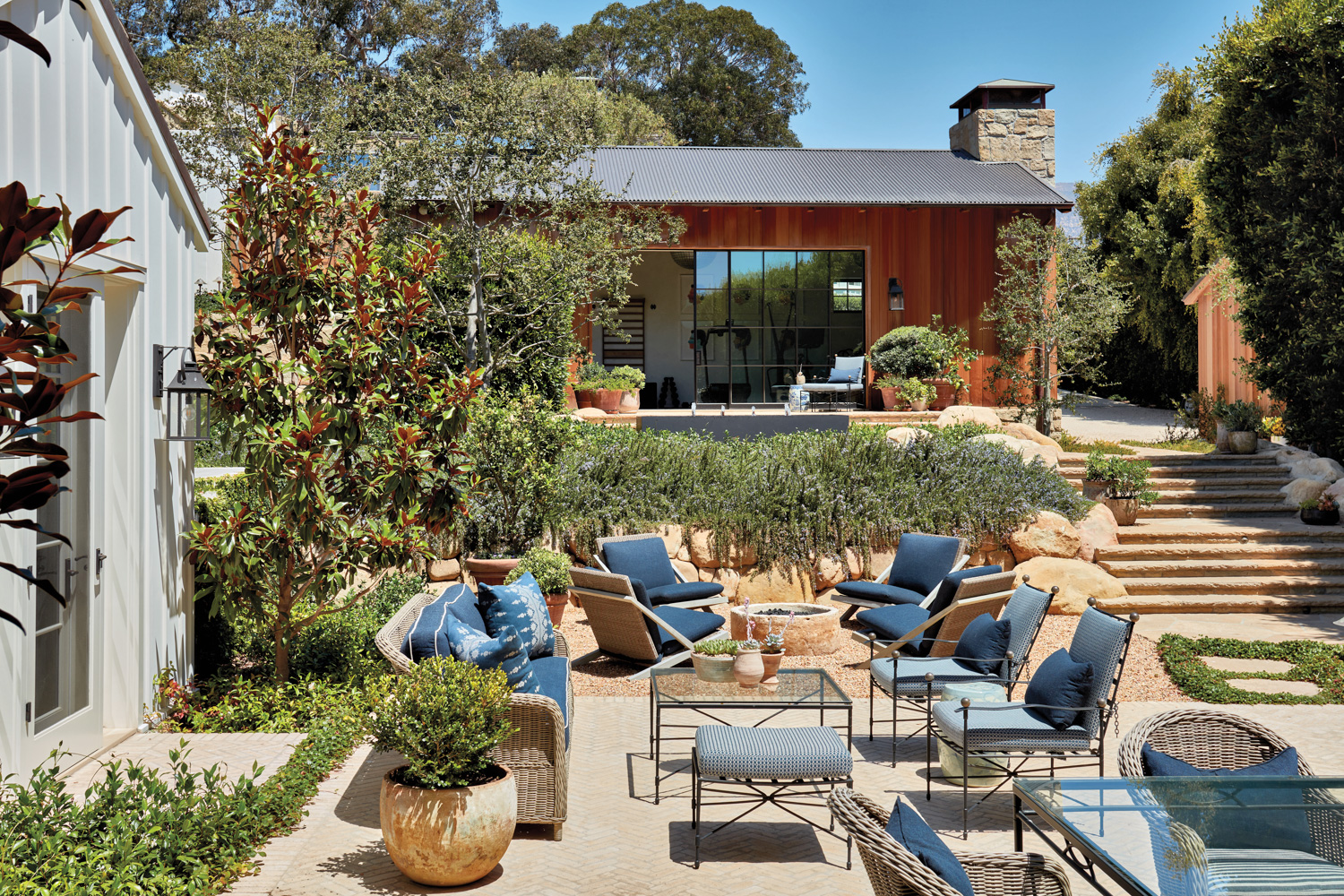 outdoor seating area with blue upholstered furnishings