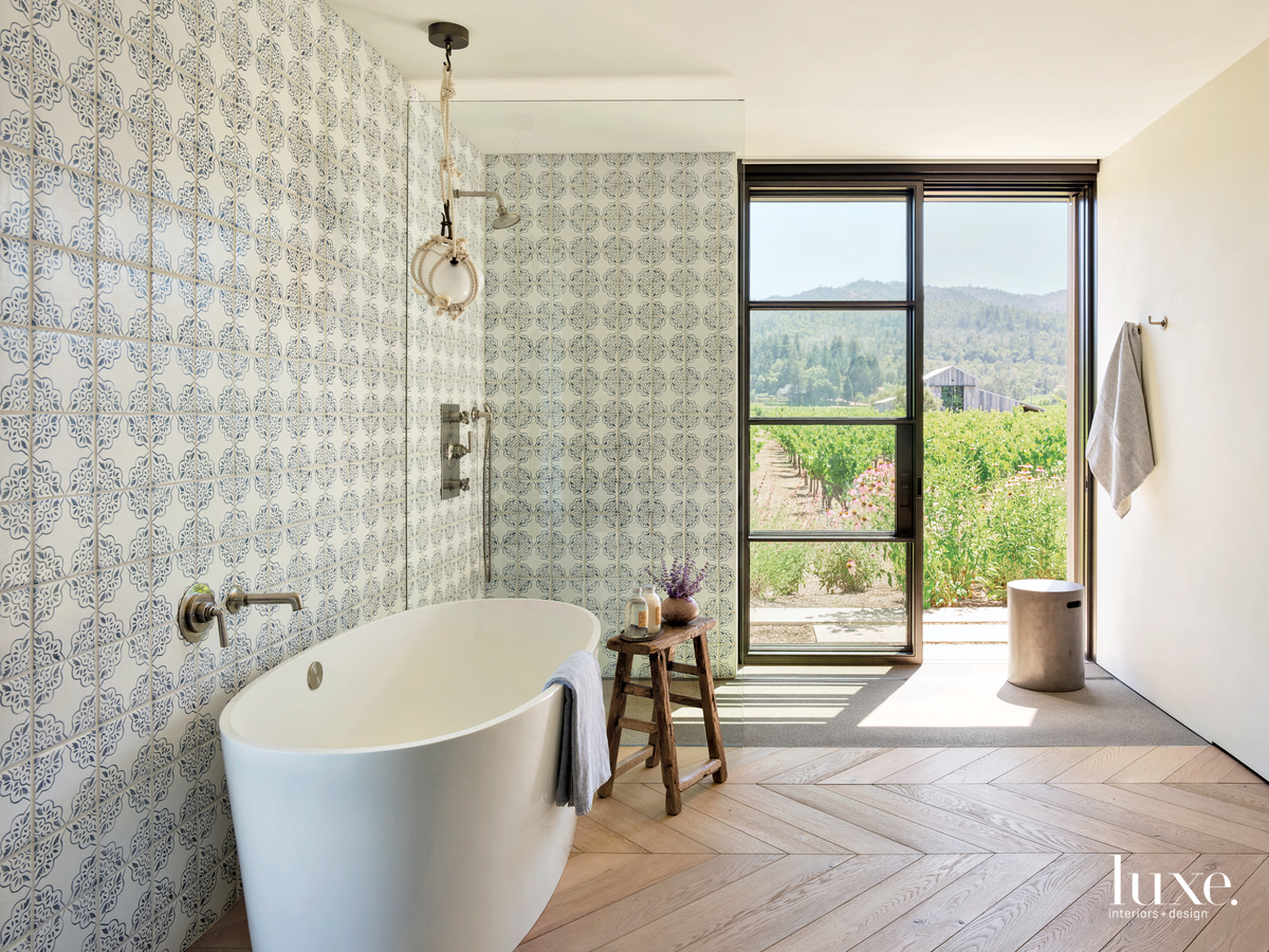 rustic bathroom white freestanding tub white-oak flooring