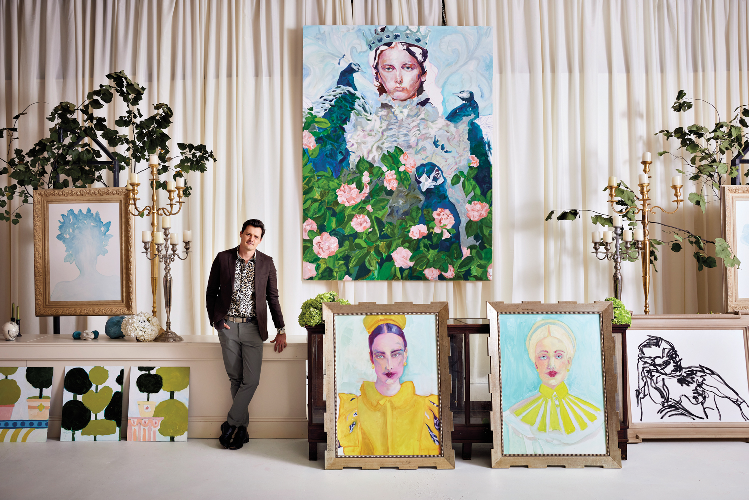 Atlanta artist Daniel Zimmerman in the midst of several large-scale paintings and candelabra