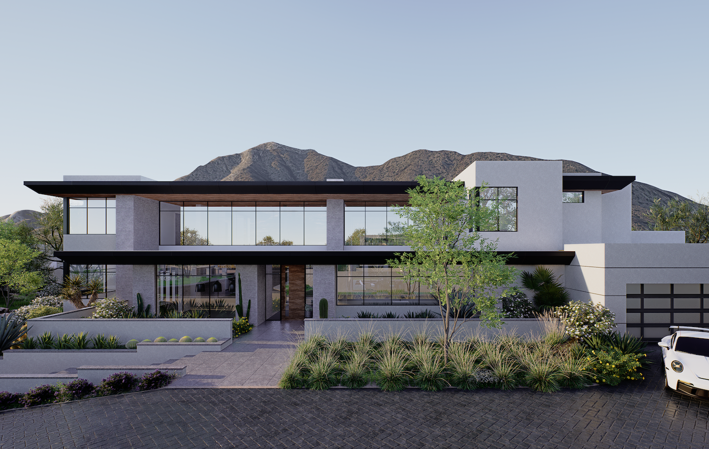 Contemporary desert-modern residence rendered in crisp white stucco and charcoal trim, featuring broad flat roof overhangs and an uninterrupted band of floor-to-ceiling glass across the façade. Succulent-filled planters and wild grasses edge the stone paver driveway—where a white sports car peeks in—while rugged mountains rise in the clear dawn sky behind.