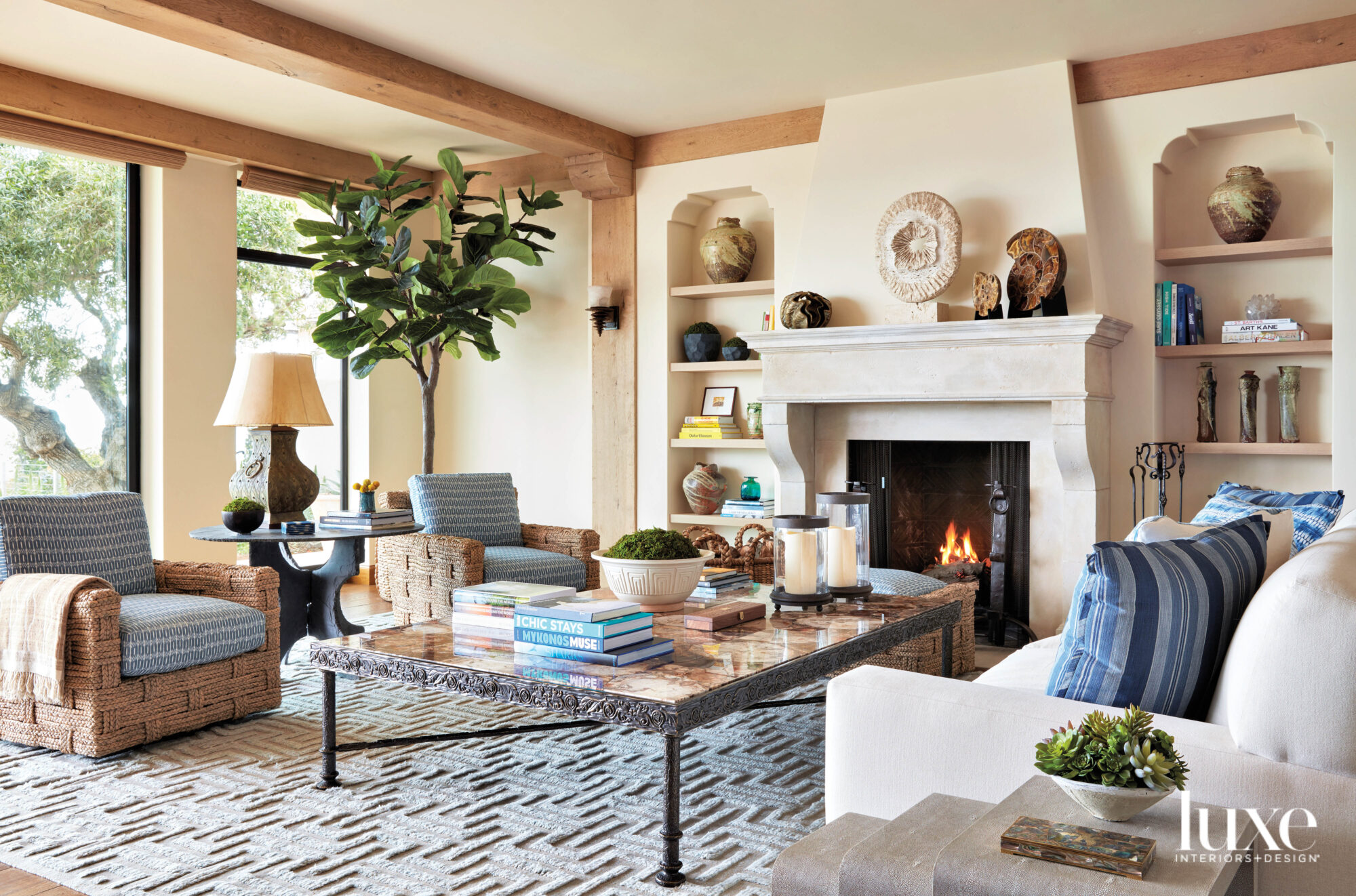 california rustic living room with fireplace, patterned rug and organic decor