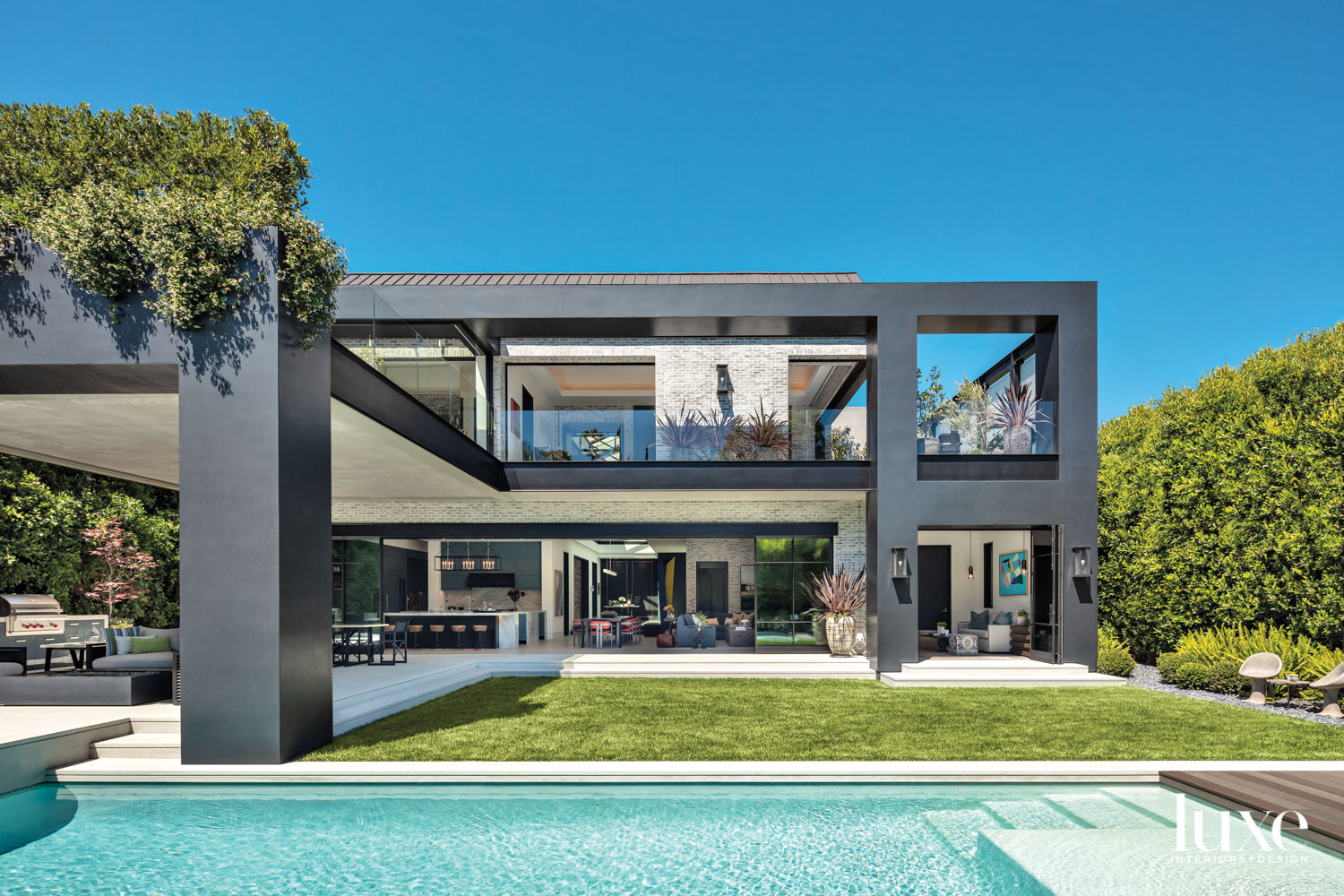 Exterior of modern house with pool in the foreground