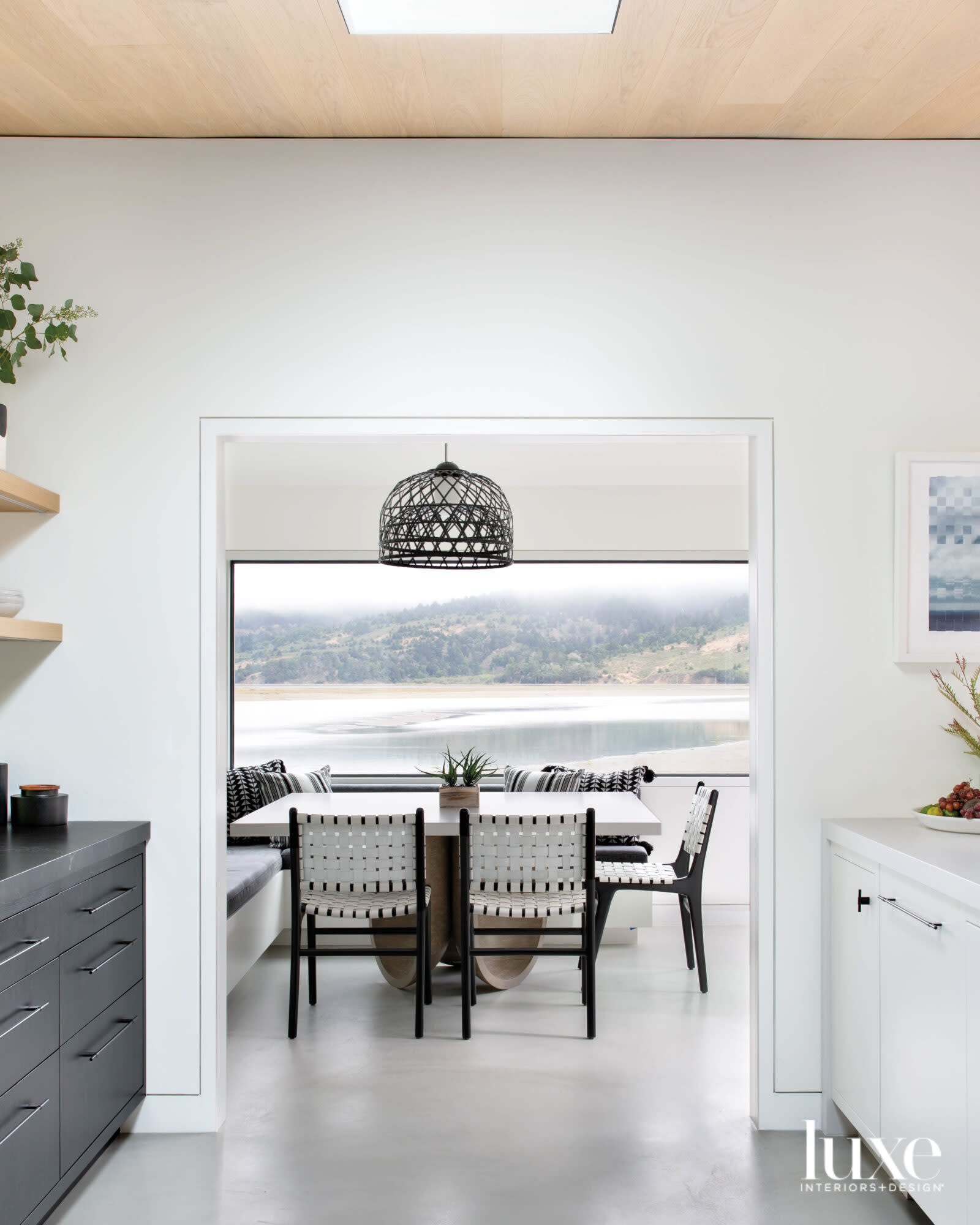 banquette with antique chairs and bamboo and steel light