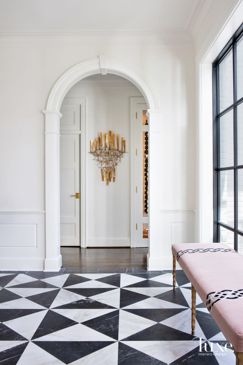 Arched doorway leading from the entry