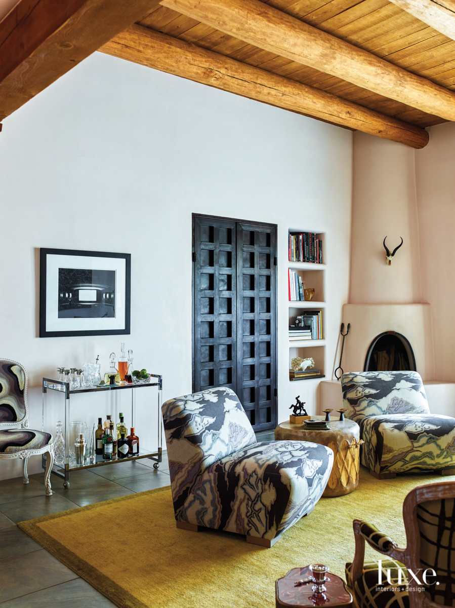 eclectic living room neutral palette patterned chairs