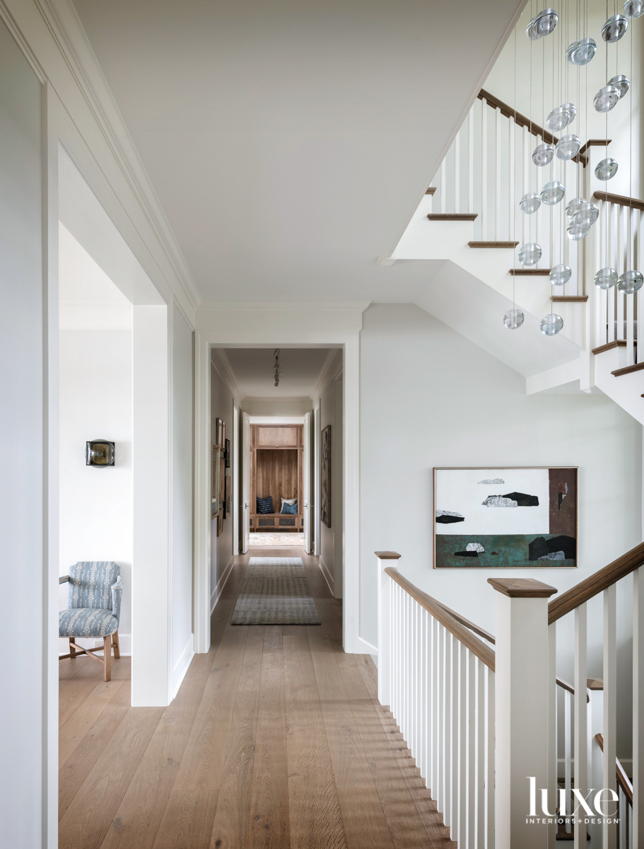 Stair hall with crystal light fixture