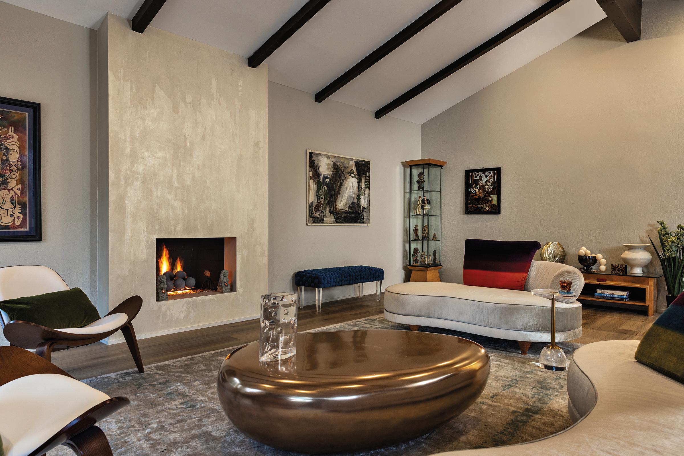 Pearlescent Venetian plaster fireplace in the Pazzam Project by Pazzam Designs, finished in a smooth, sculptural form that reads as an architectural art piece.