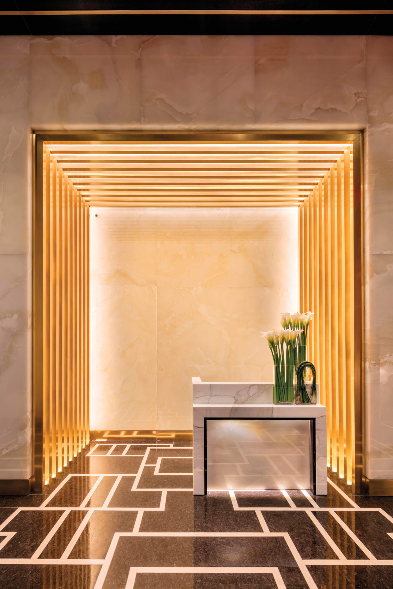 foyer of luxurious high rise in Manhattan with orange glow