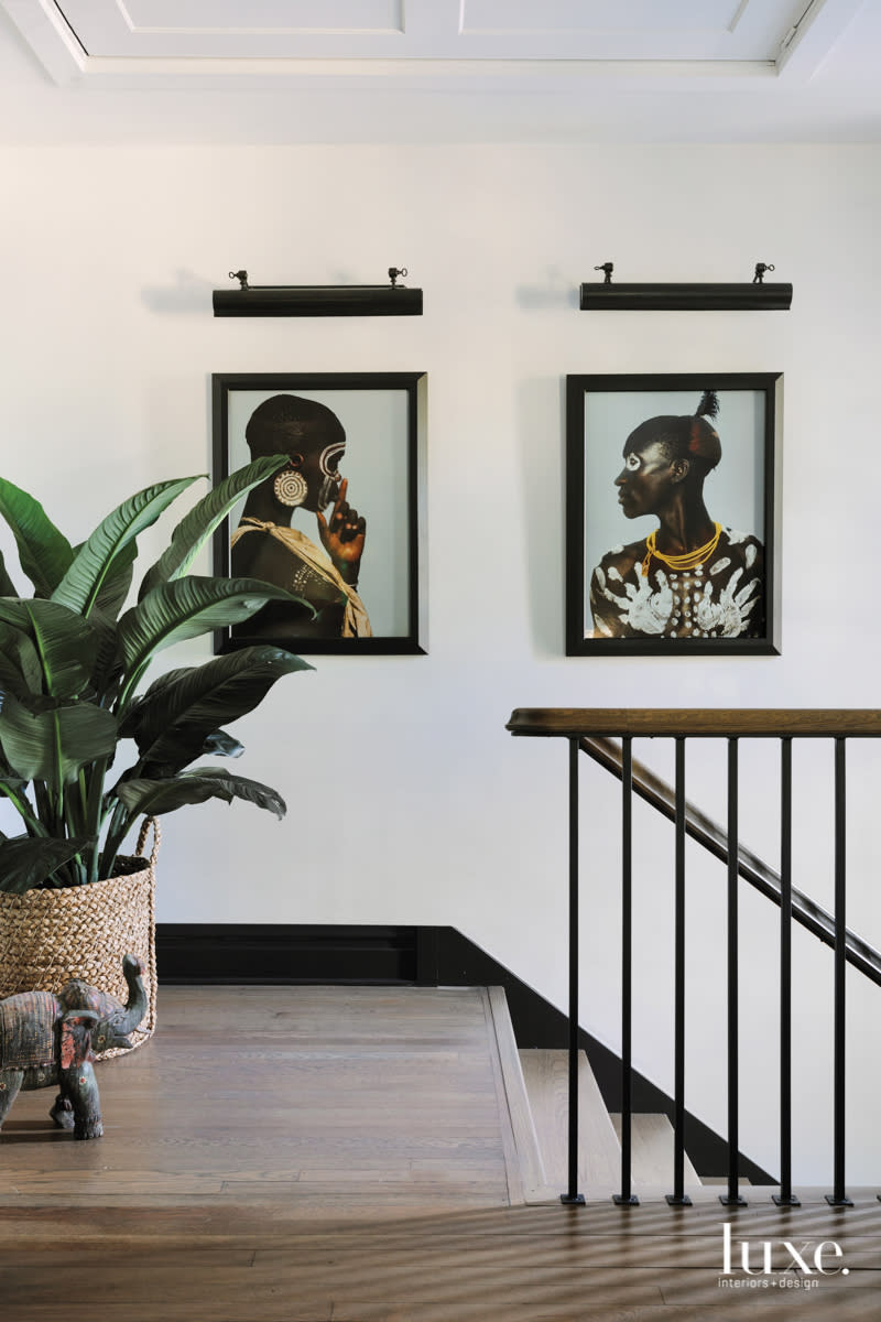 African-inspired portraits are at the top of the staircase.