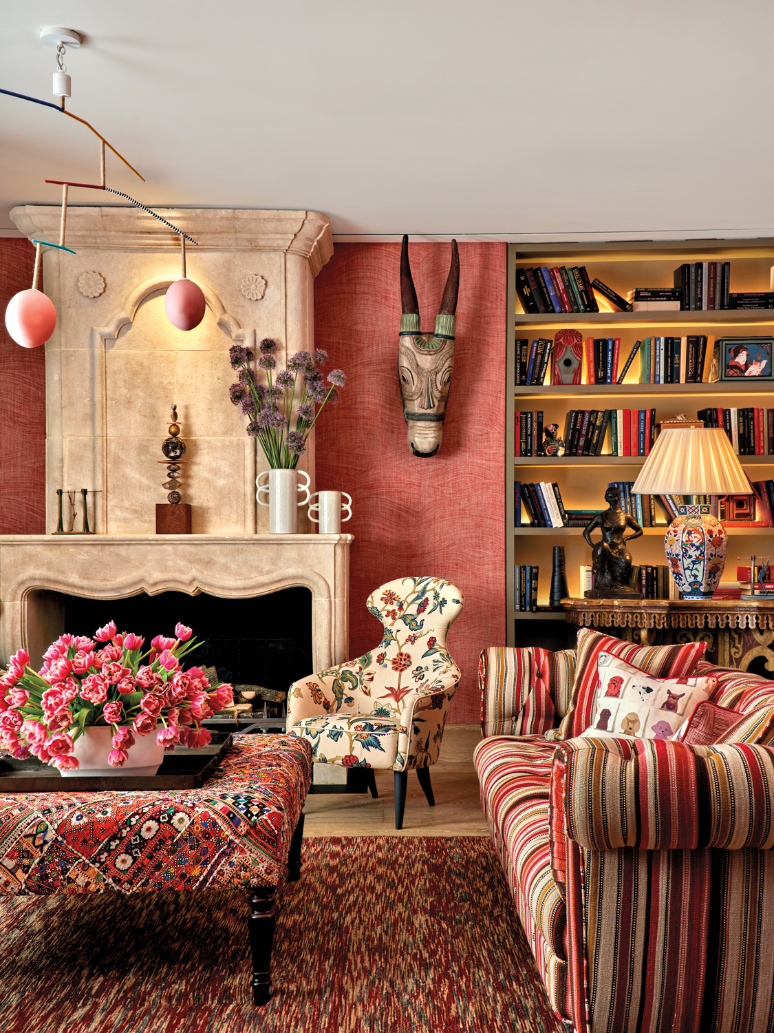 living area with red walls and matching textiles throughout the space