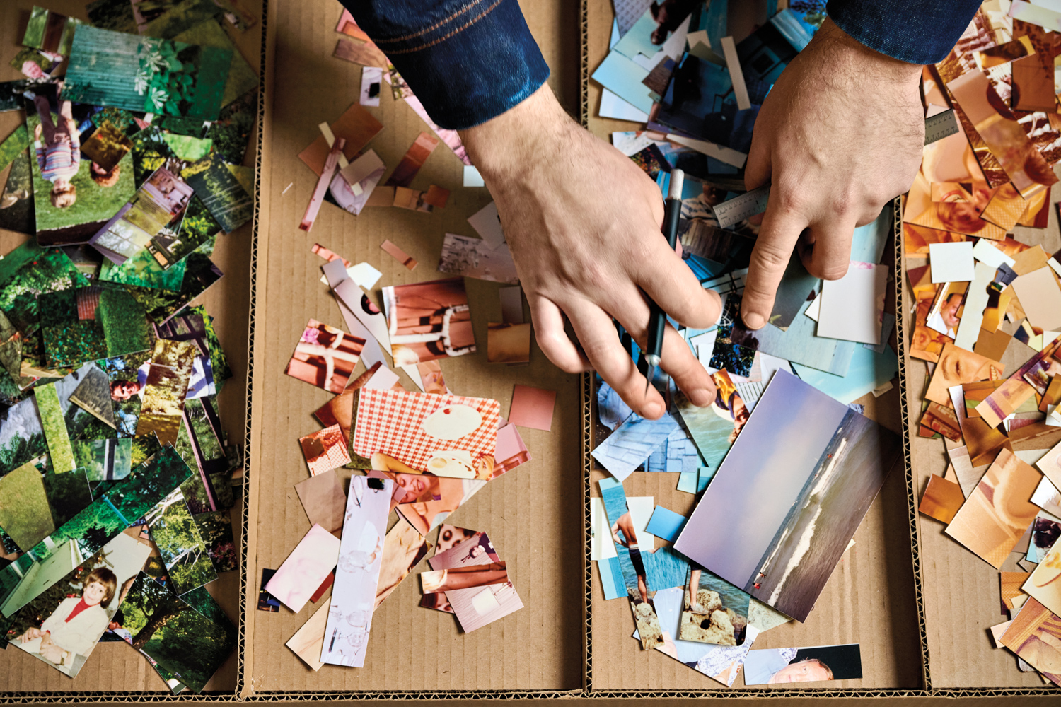 Joe Rudko cutting and sorting photographs