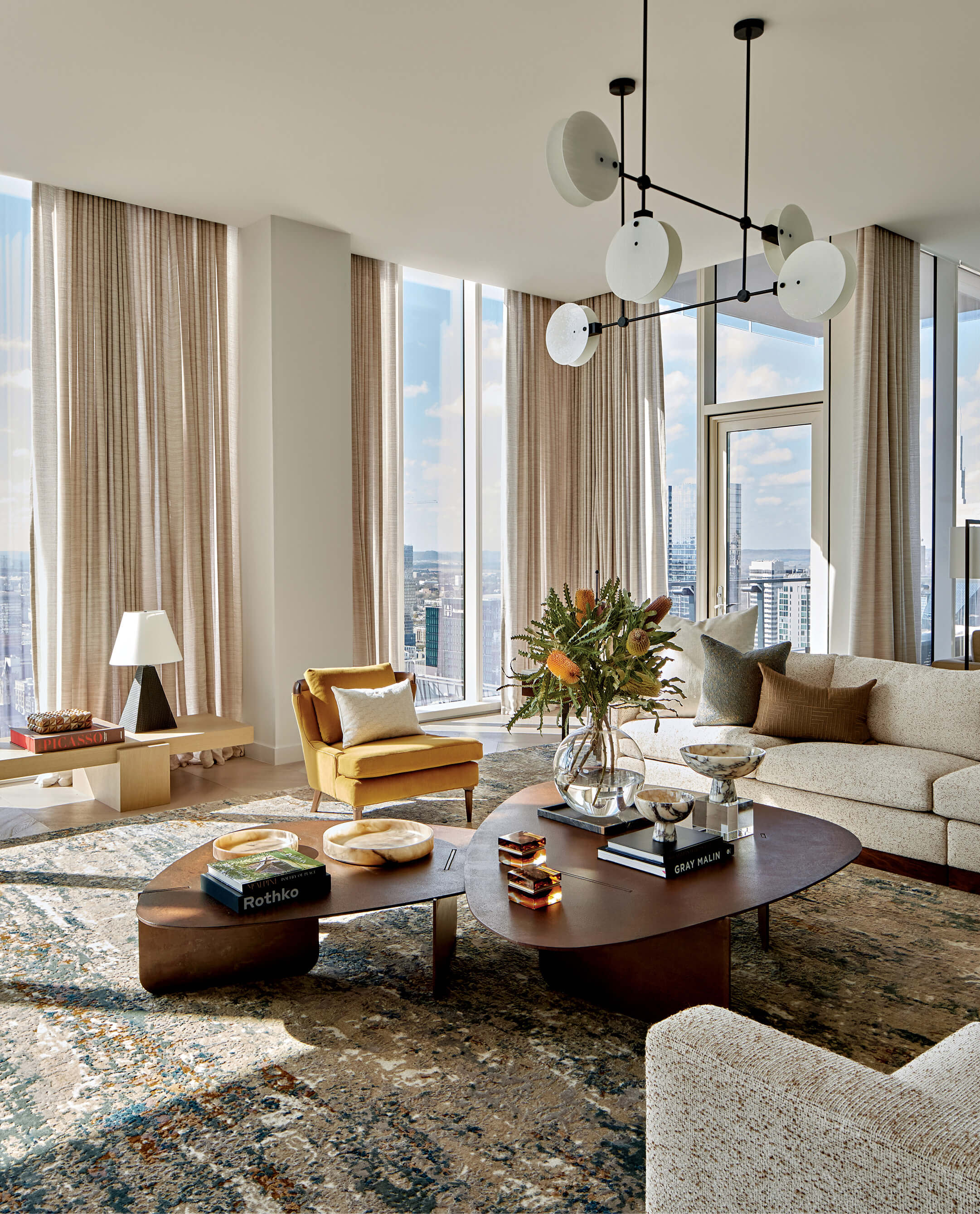 contemporary living room with skyline views out the window