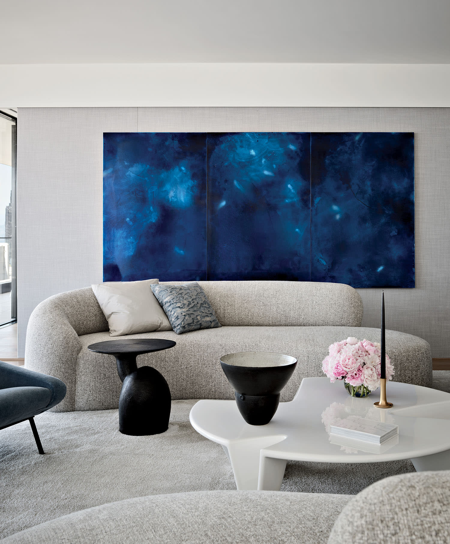 living room featuring Peter Alexander’s Culebra on one wall above a sofa