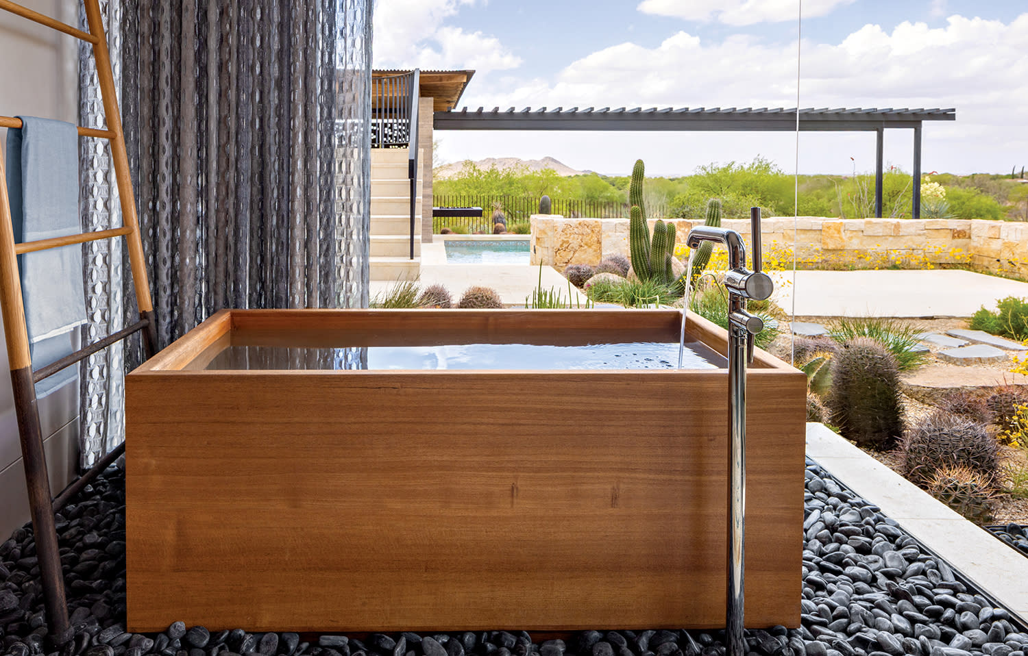 modern bathroom featuring a teak Japanese Ofuro tub by Zen Bathworks