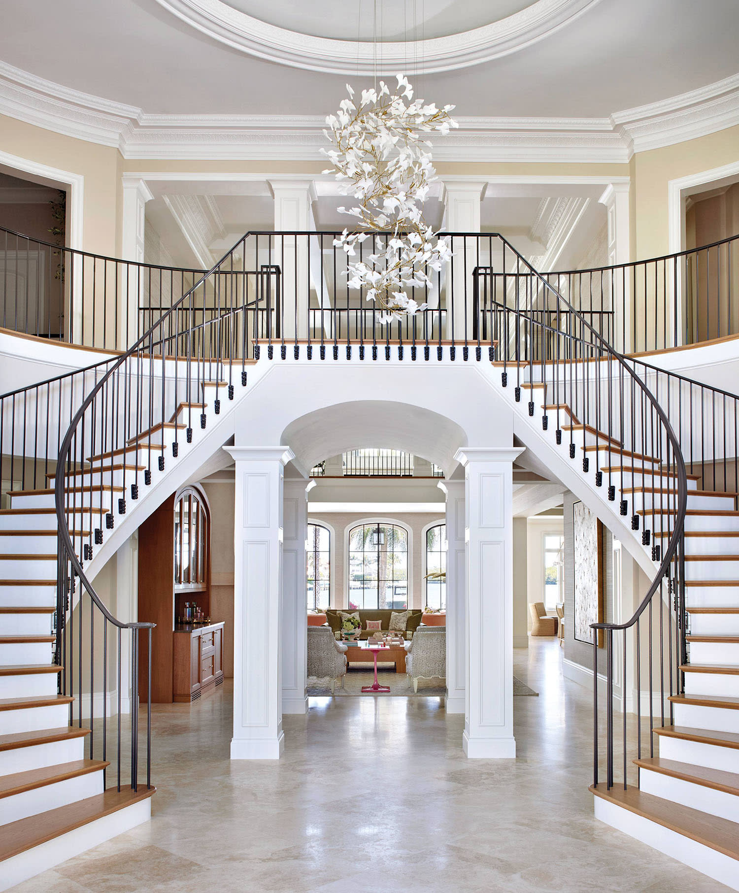 Vakkerlight’s Gingko chandelier crowns the foyer above a staircase with European white oak treads