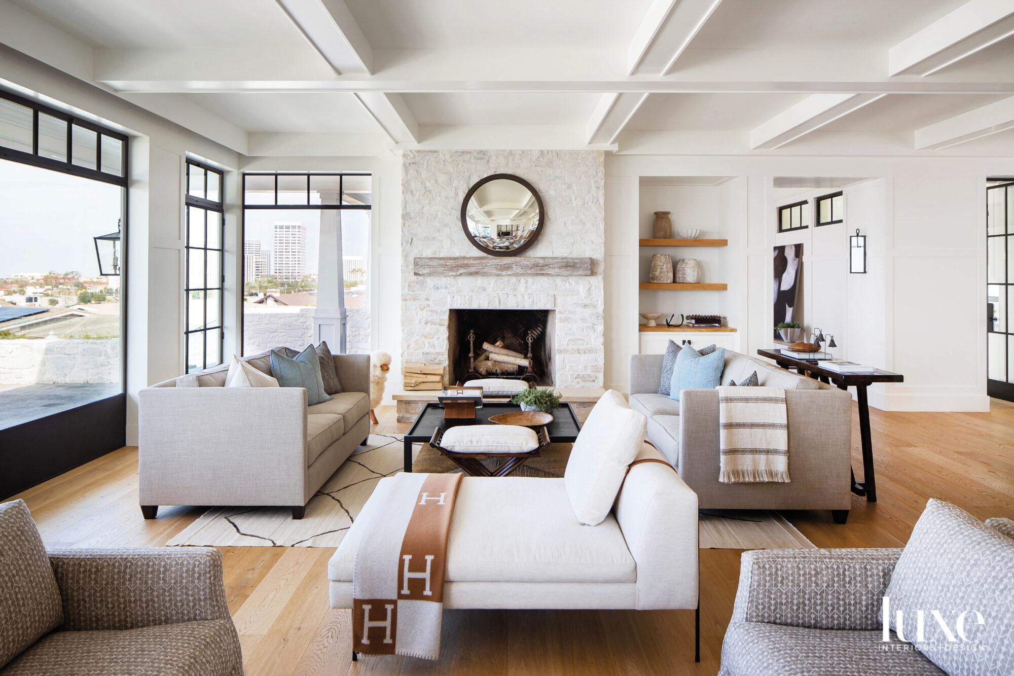 Living room view facing fireplace with mirror above