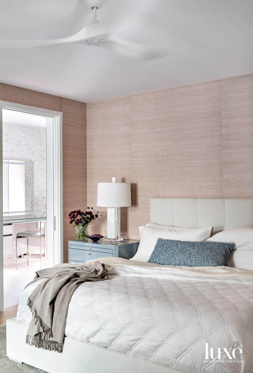 Main bedroom with subtle grasscloth wallpaper.