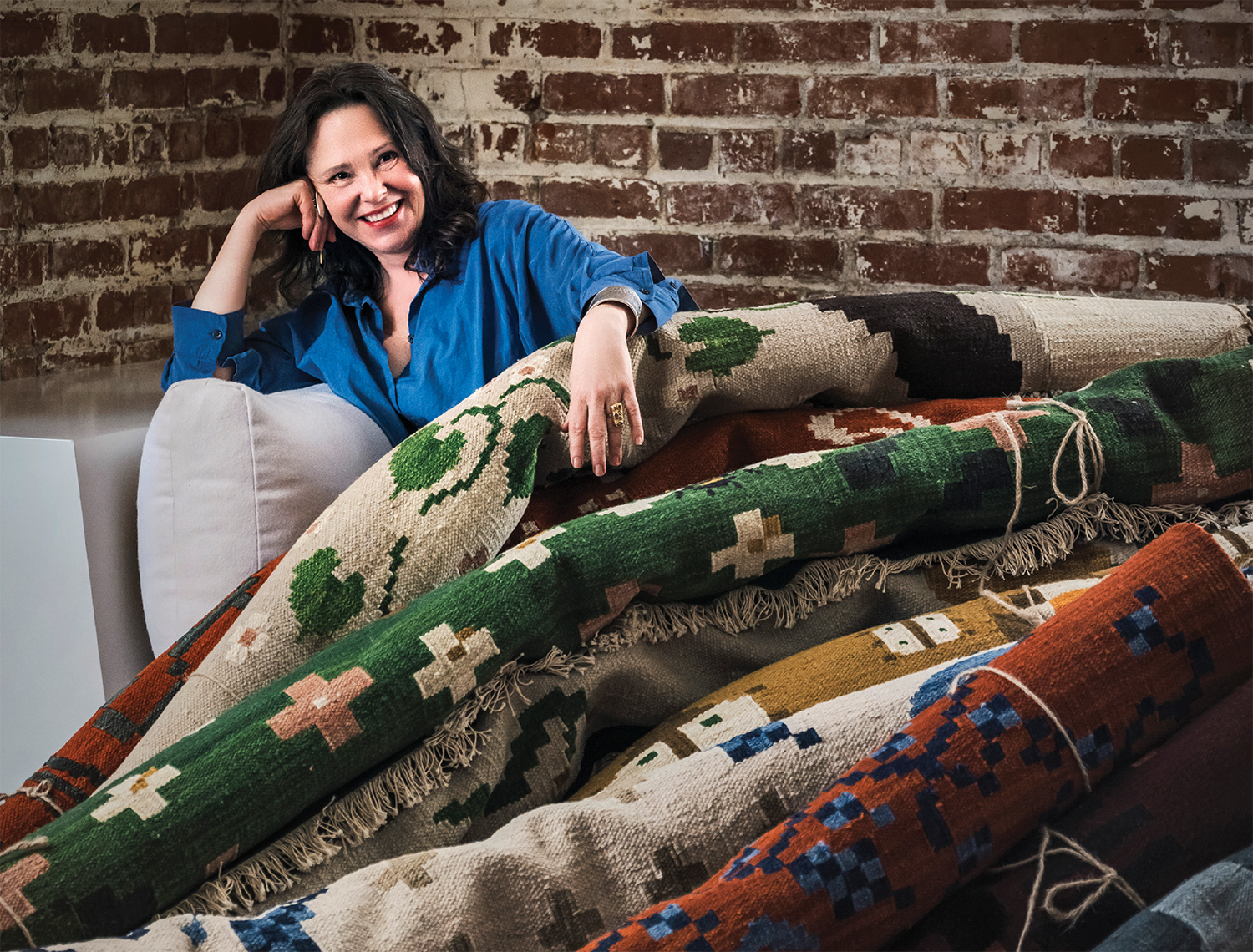 Jessica Helgerson poses with rugs from her collaboration with Kush Rugs