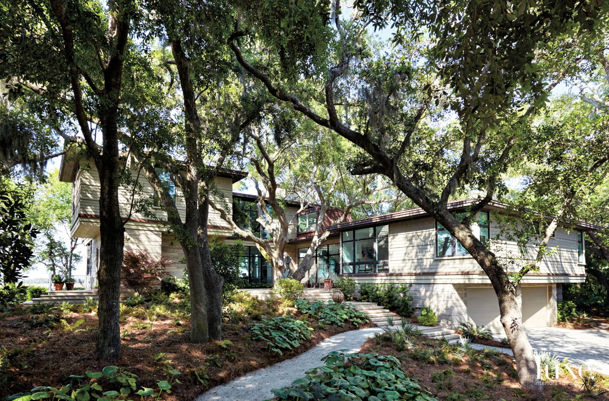 modernist home exterior with lush landscape