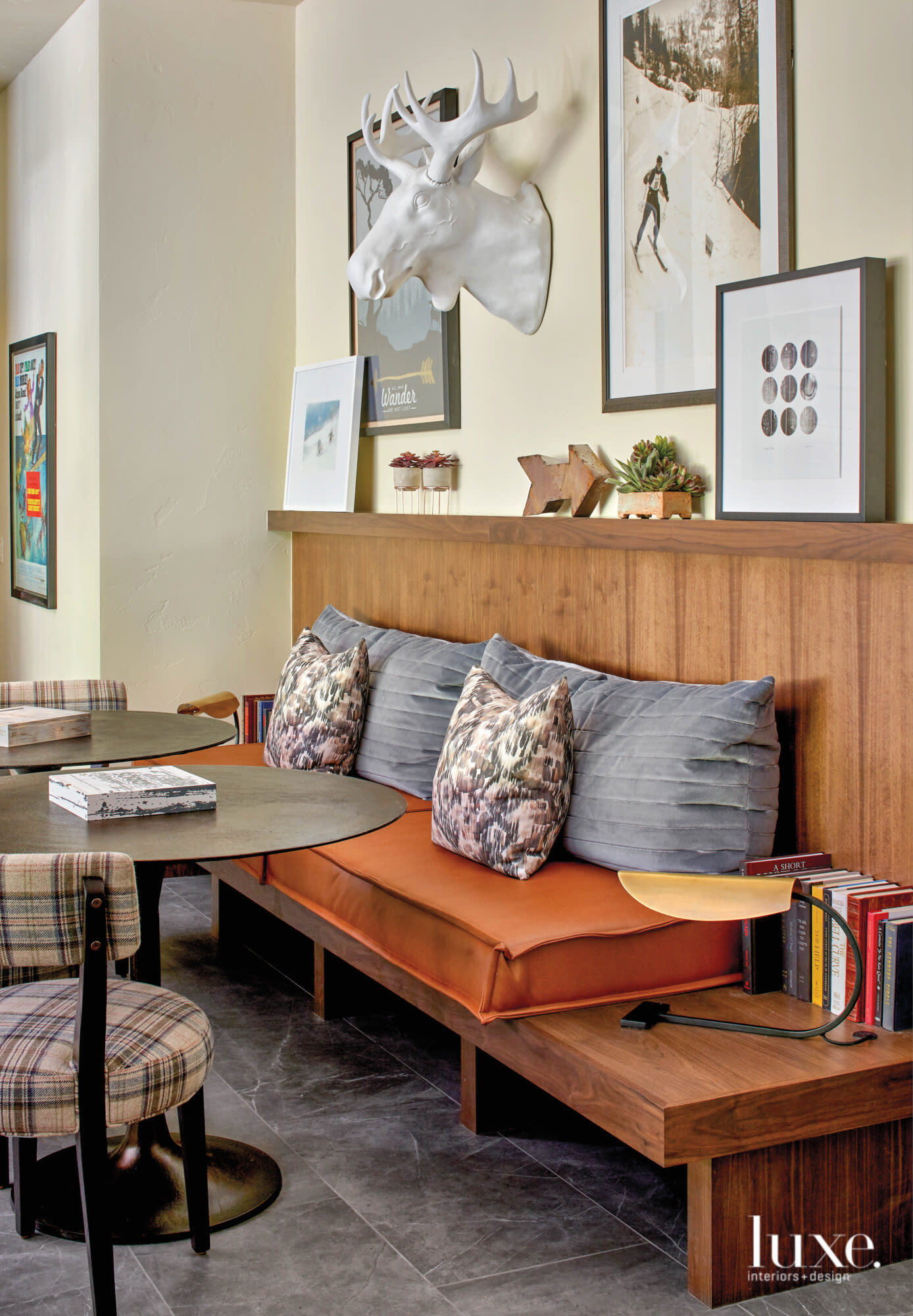 In a lower-level recreation room, a built-in banquette provides seating.